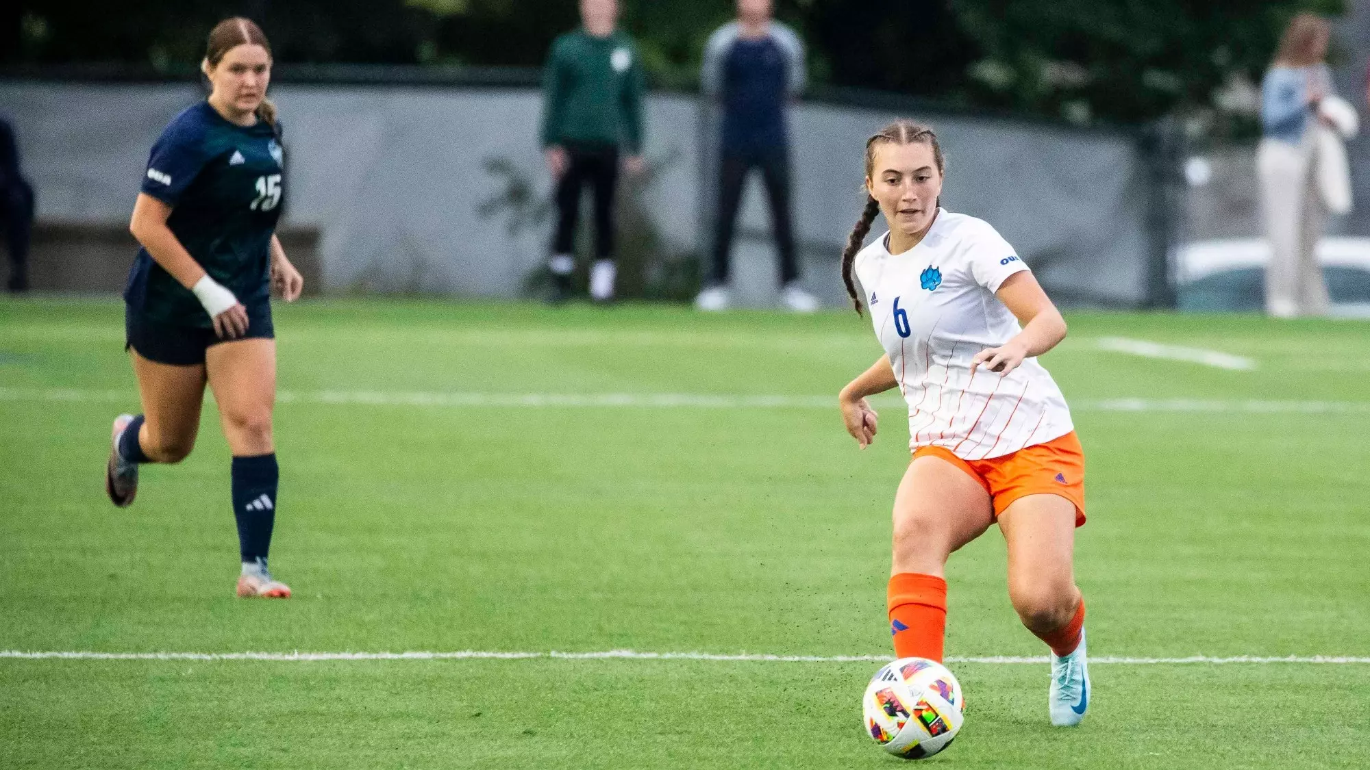 Mary Nicolaou passing the ball.