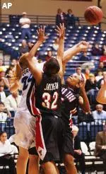 Texas Tech's Casey Jackson (32) and Jia Perkins, right, go for a loose ball against San Diego's Jamie Corwin at the Jenny Craig Pavillion at the University of San Diego, Tuesday, Dec. 30, 2003, in San Diego. (AP Photo/Sandy Huffaker)