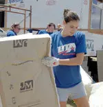 Senior outside hitter Ashley Van Antwerp lends a helping hand during a Habitat for Humanity project on Aug. 18.