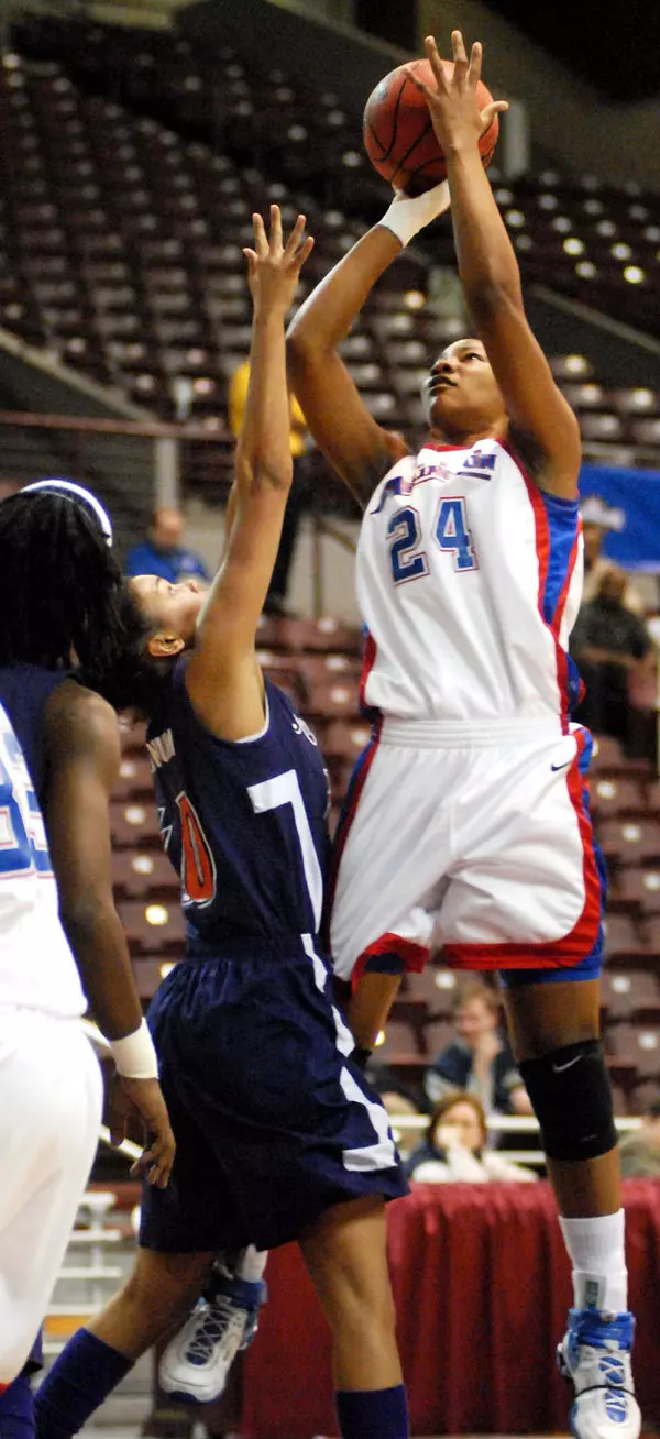 24 - UT Arlington junior center Tiffeny Riles (24) shoots over Northwestern State's Ashli Barnum during the first half of the Mavs' 62-53 win over the Demons in the opening round of the O'Reilly Auto Parts Southland Conference Basketball Tournament Wednesday night. Riles finished with a team-high 16 points to lead the Mavs into Friday's semifinals. (Robert Crosby UTA Photo Services)