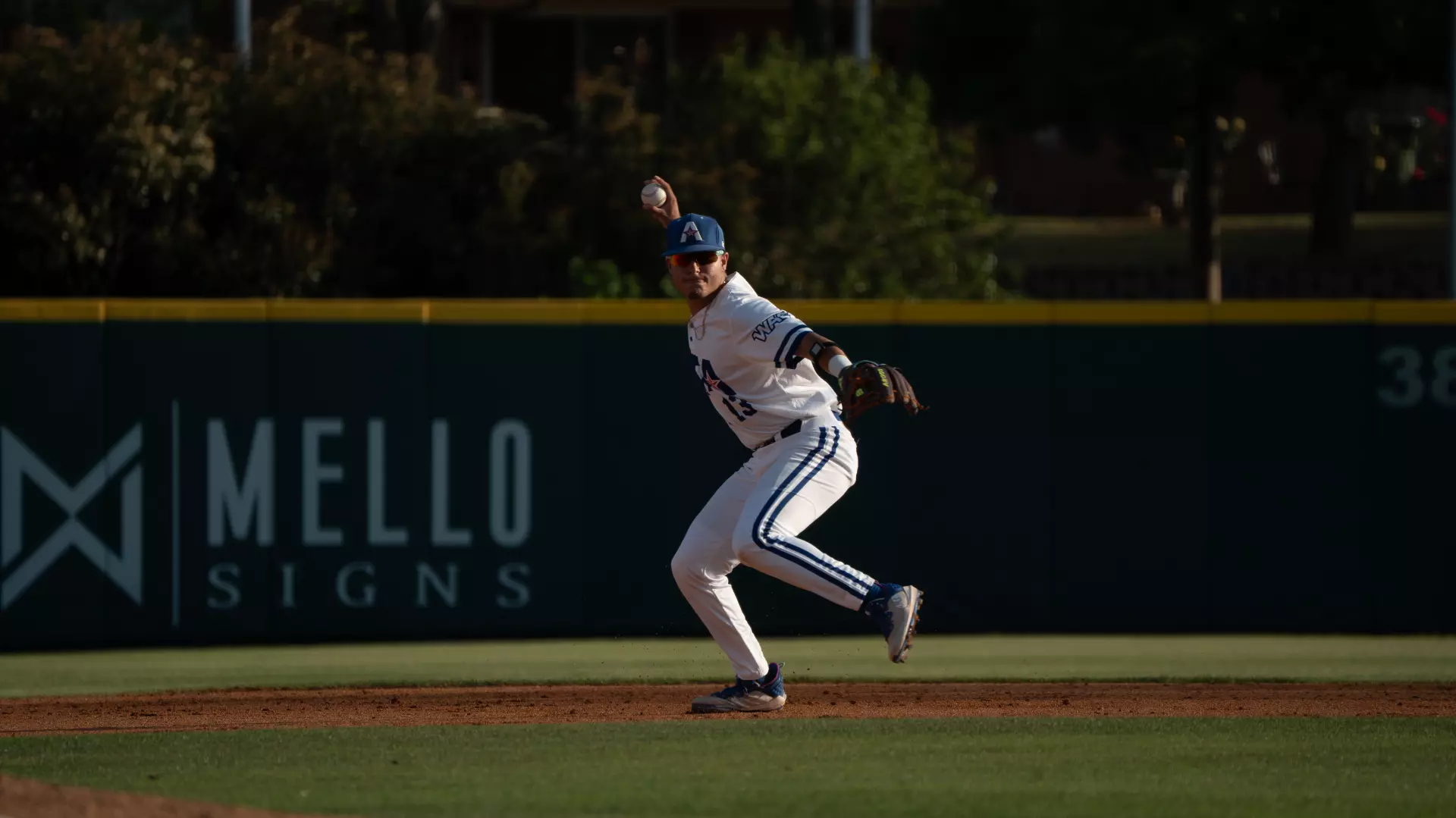 Laracuente throwing to first base