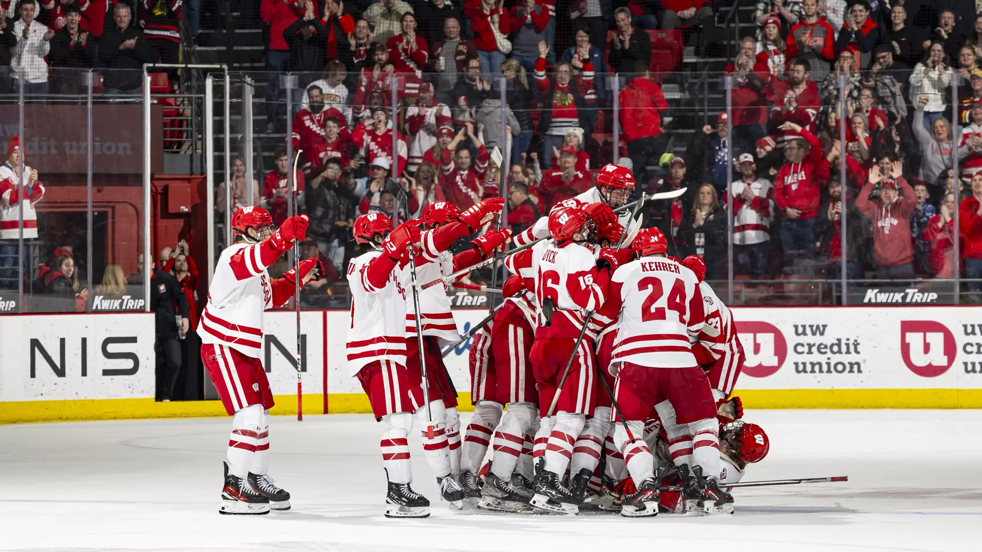 The team celebrates winning the shootout against Minnesota in front of a sold out Kohl Center crowd.