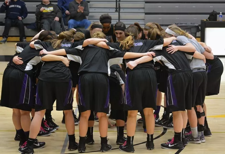 Warhawks huddle before the game