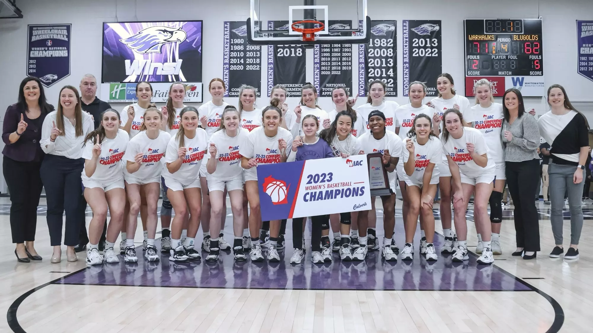 The Warhawk women pose with the WIAC Tournament Championship trophy