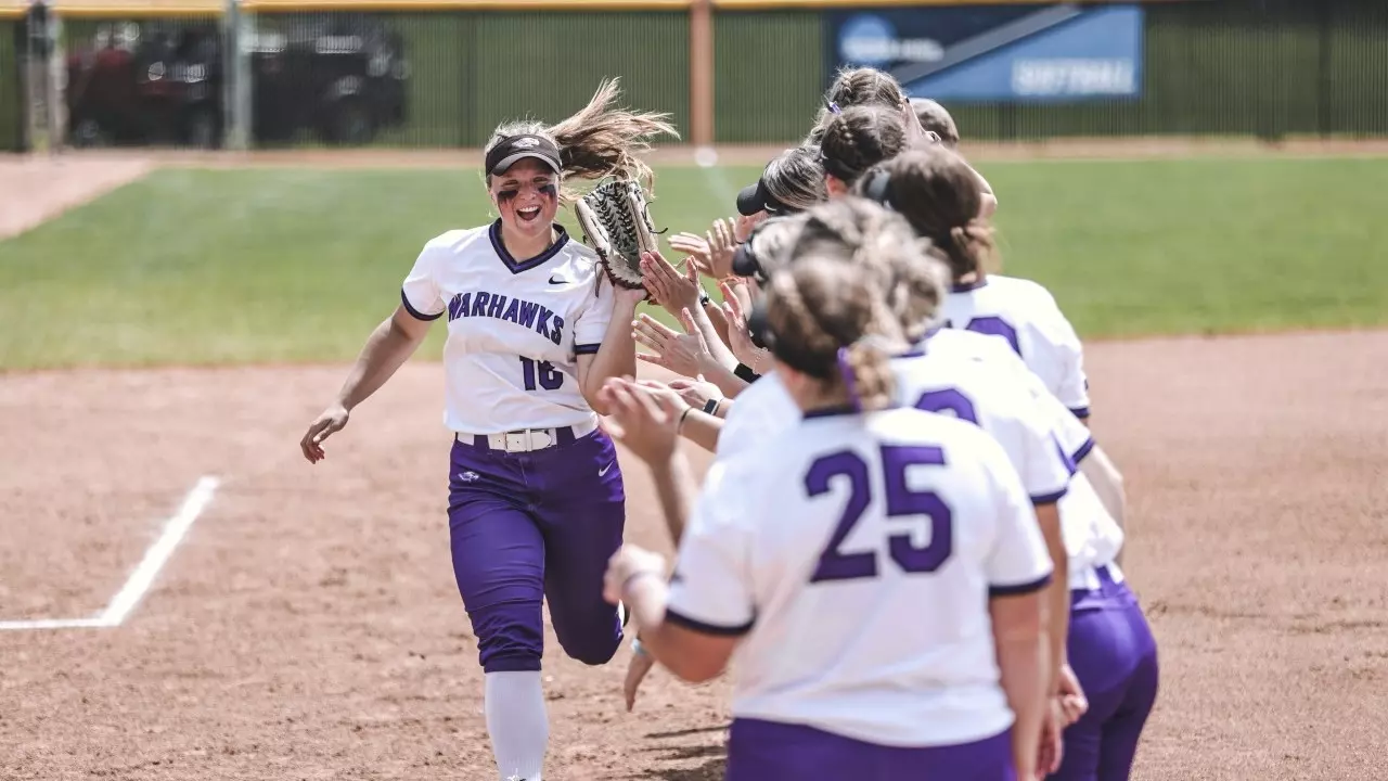 Kiarra Kostroski runs down the line as starters are announced