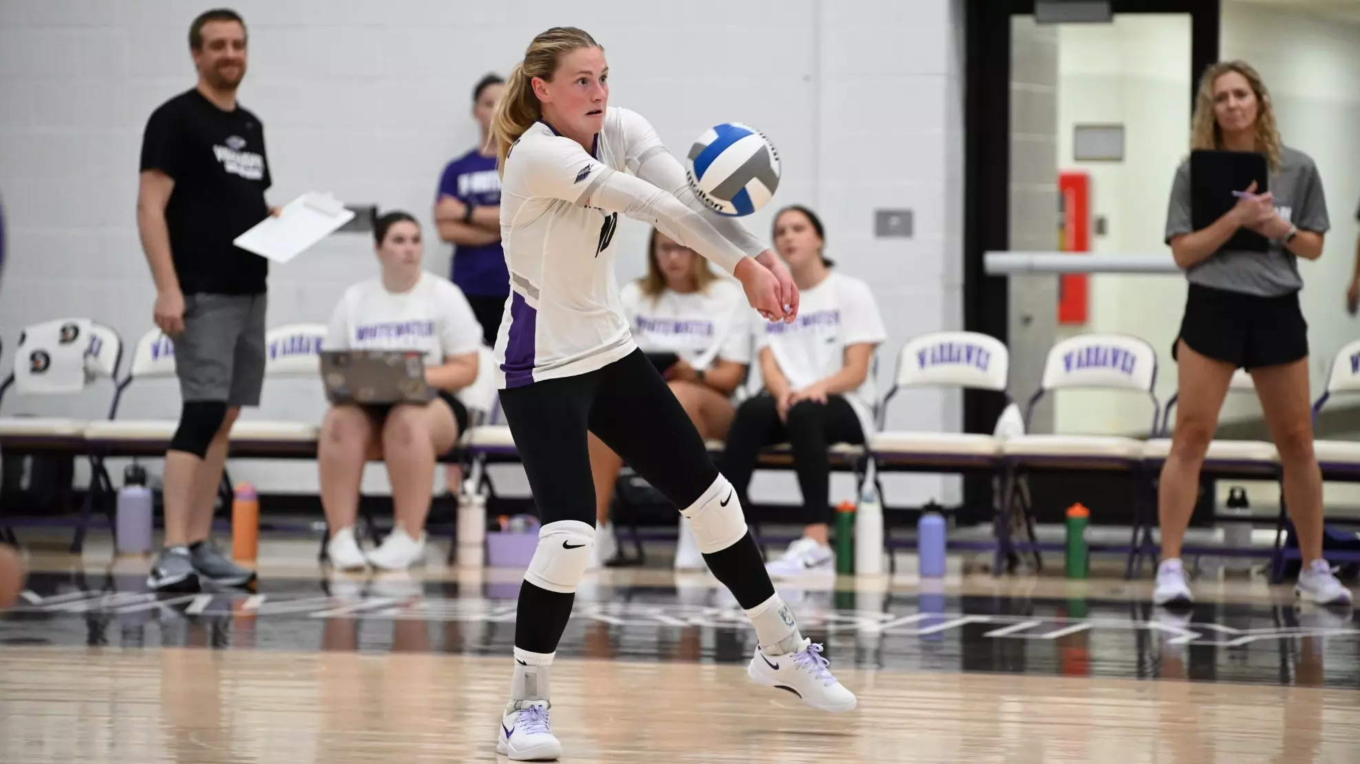 Jaedynn Evans digs a ball during a home match