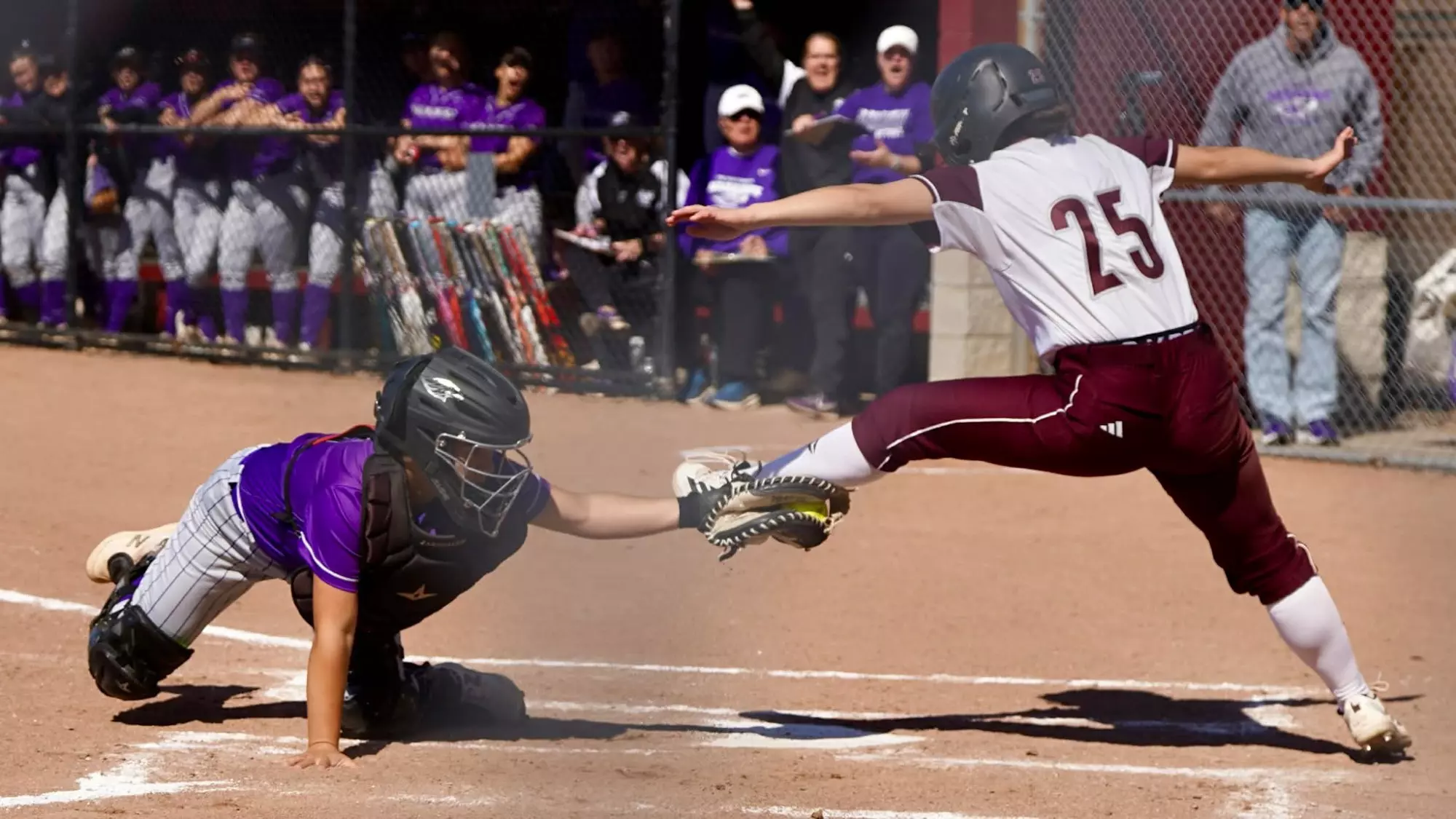 Jakosalem tags a Maroon runner out at home