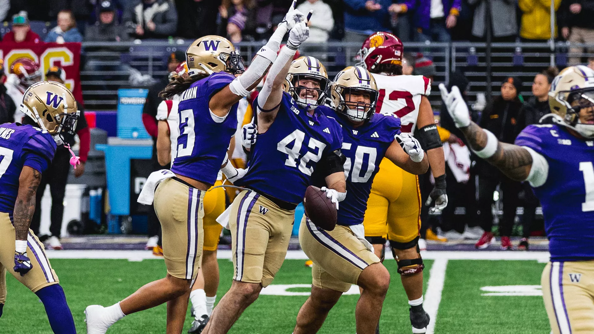 Carson Bruener celebrates with his teammates after the interception against USC