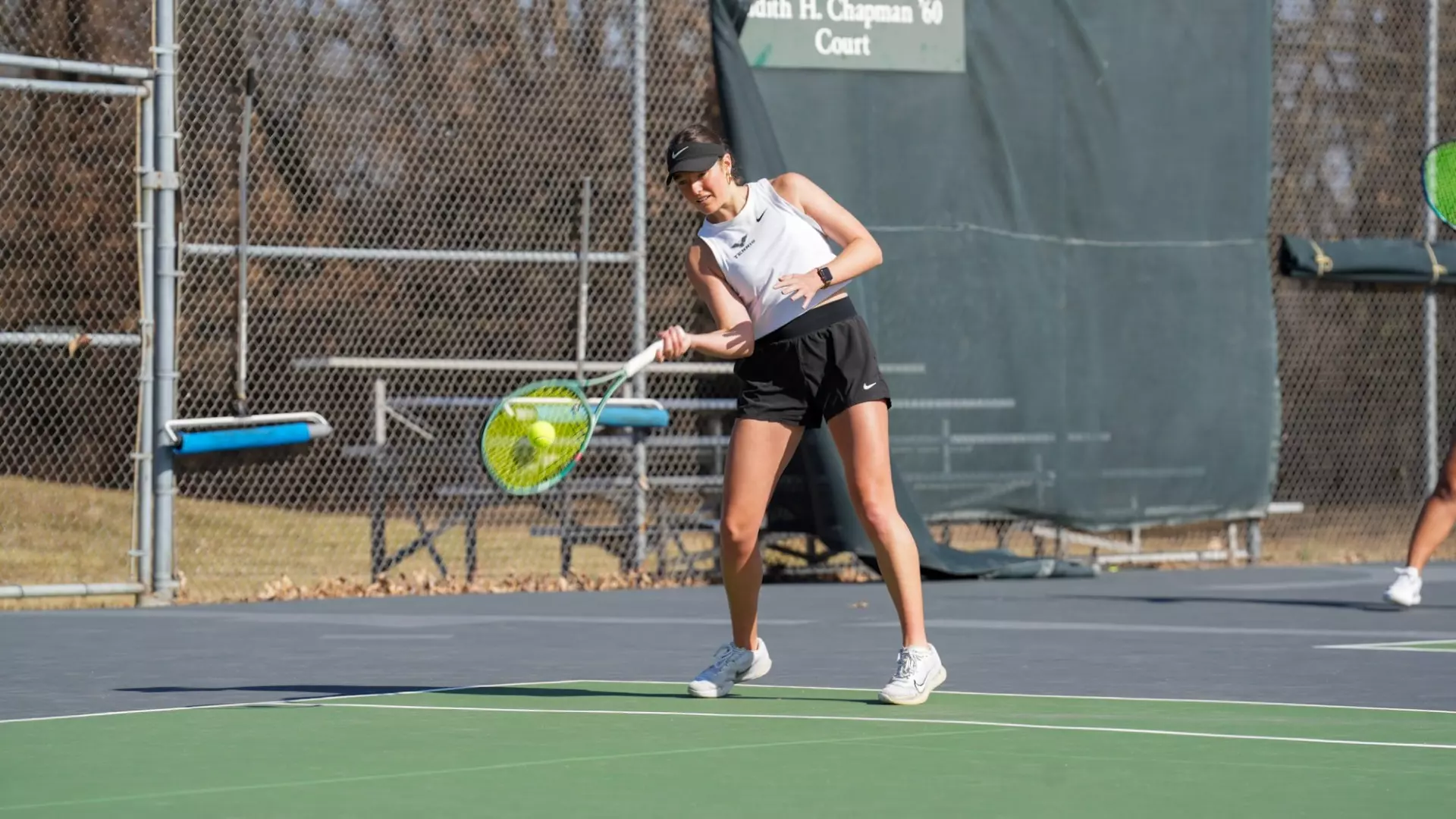 Zara Littlejohn on a forehand return