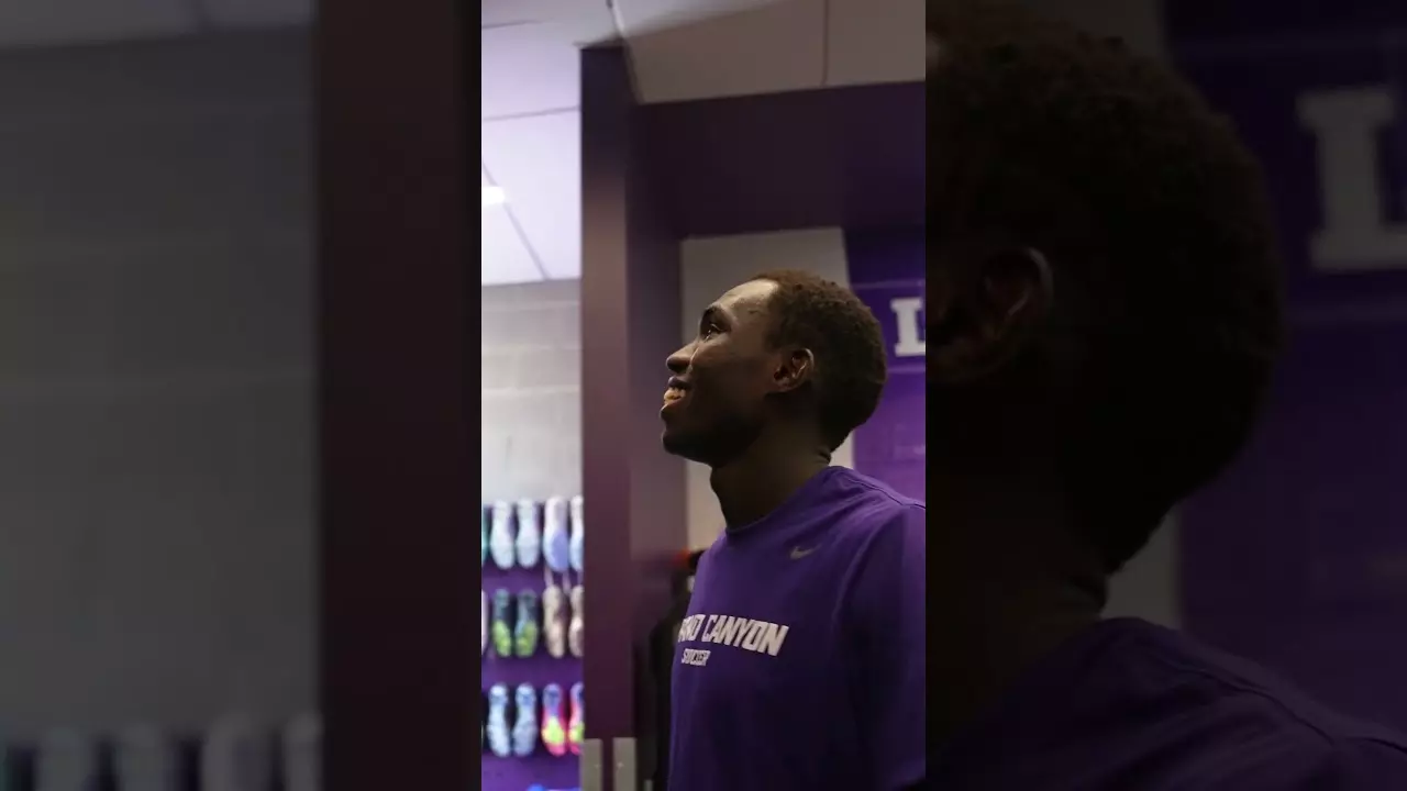 2024-25 Team Captain Ben Assane stopped by to see the new art in our locker room.