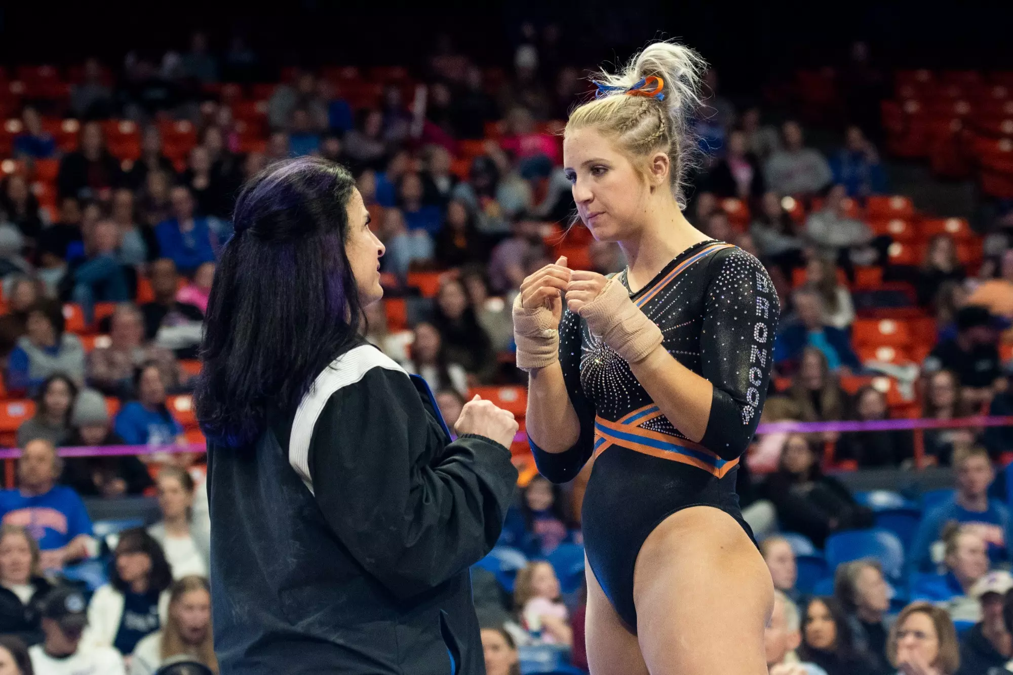 Courtney Blackson talking to head coach Tina Bird against BYU