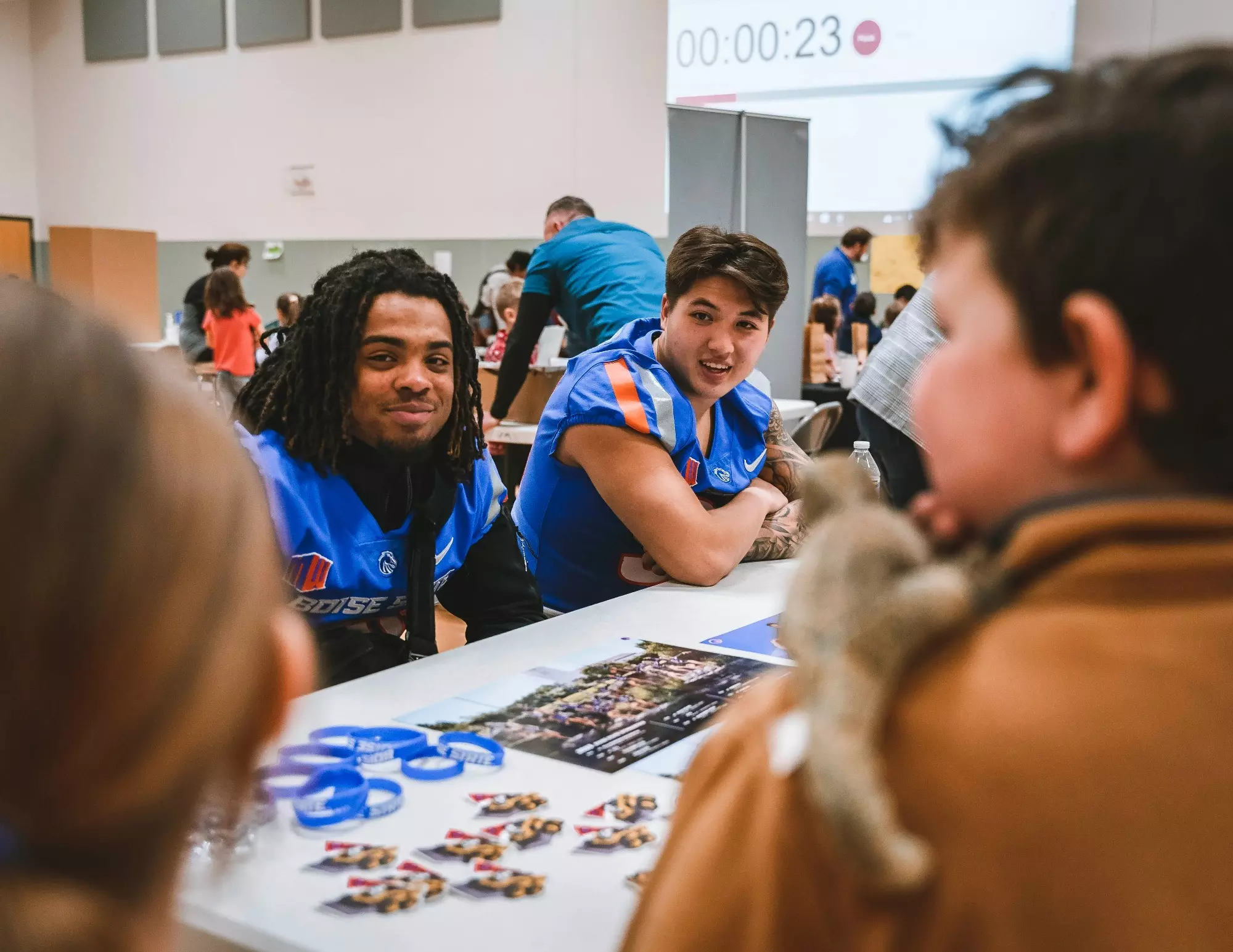 Boise State football players spend time volunteering in elementary classrooms.
