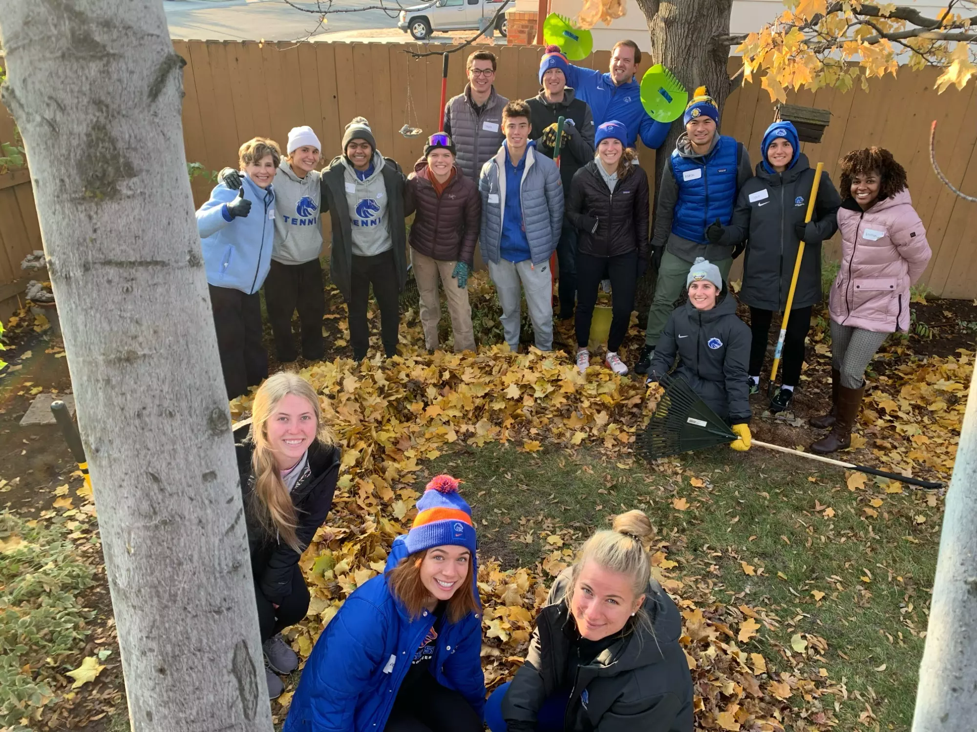 Boise State staff and student-athletes participate in Rake Up Boise.