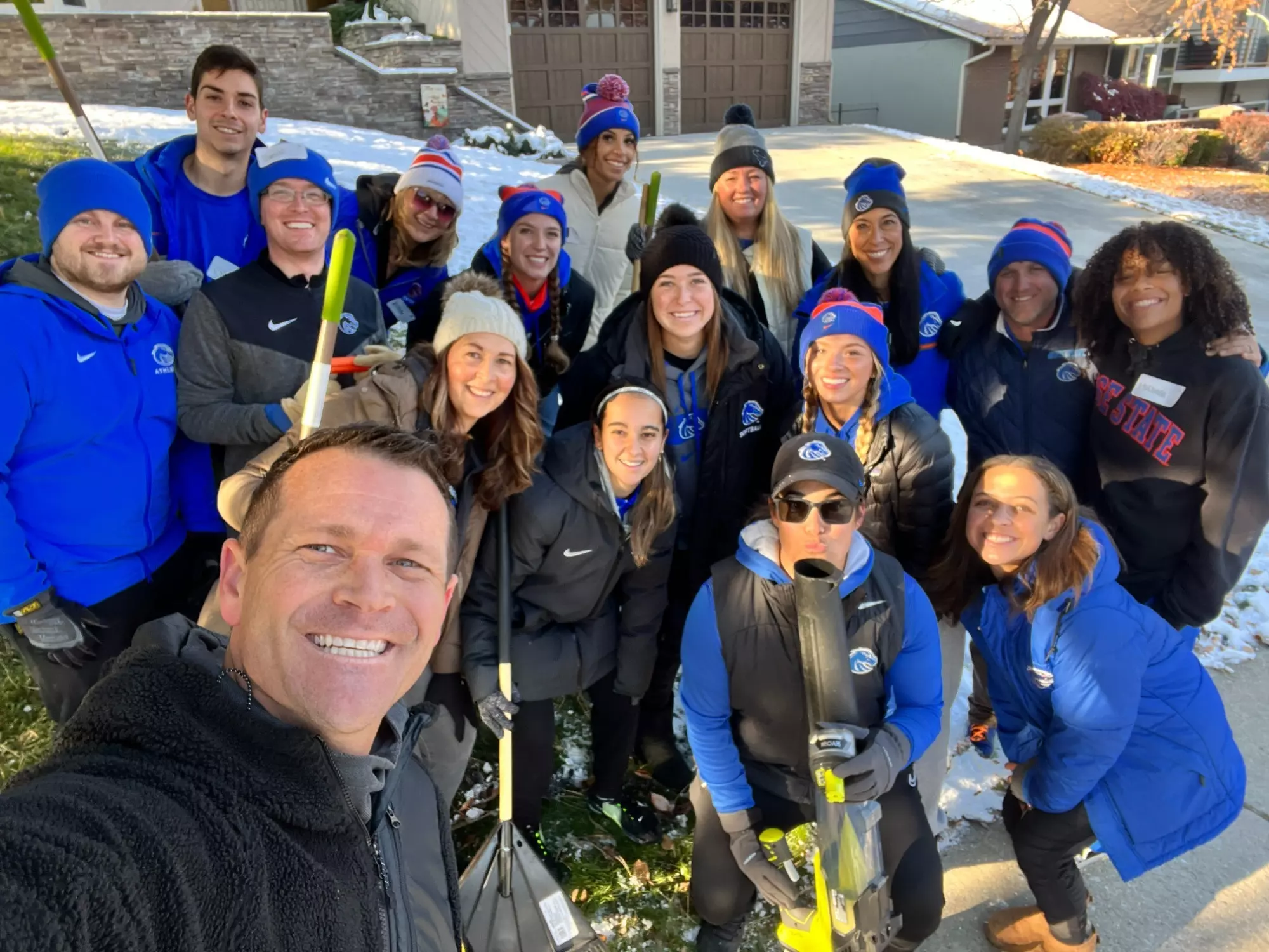 Boise State staff and student-athletes participate in Rake Up Boise.