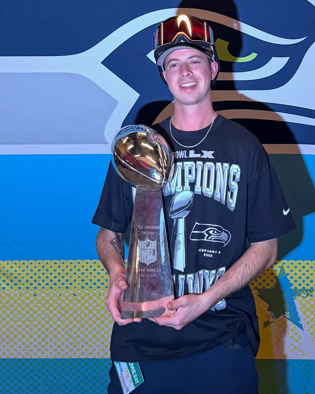 Doug DeKerchove holding the Lombardi trophy