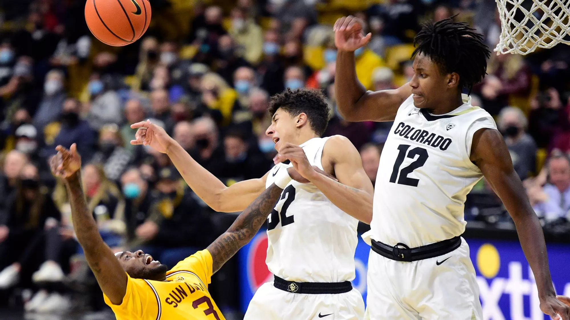 BOULDER, CO, February 24, 2022: University of Colorado Boulder's Nique Clifford blocks the shot of Arizona State's Marreon Jackson during a Pac-12 game in Boulder on February 24, 2022.(Cliff Grassmick/Staff Photographer)