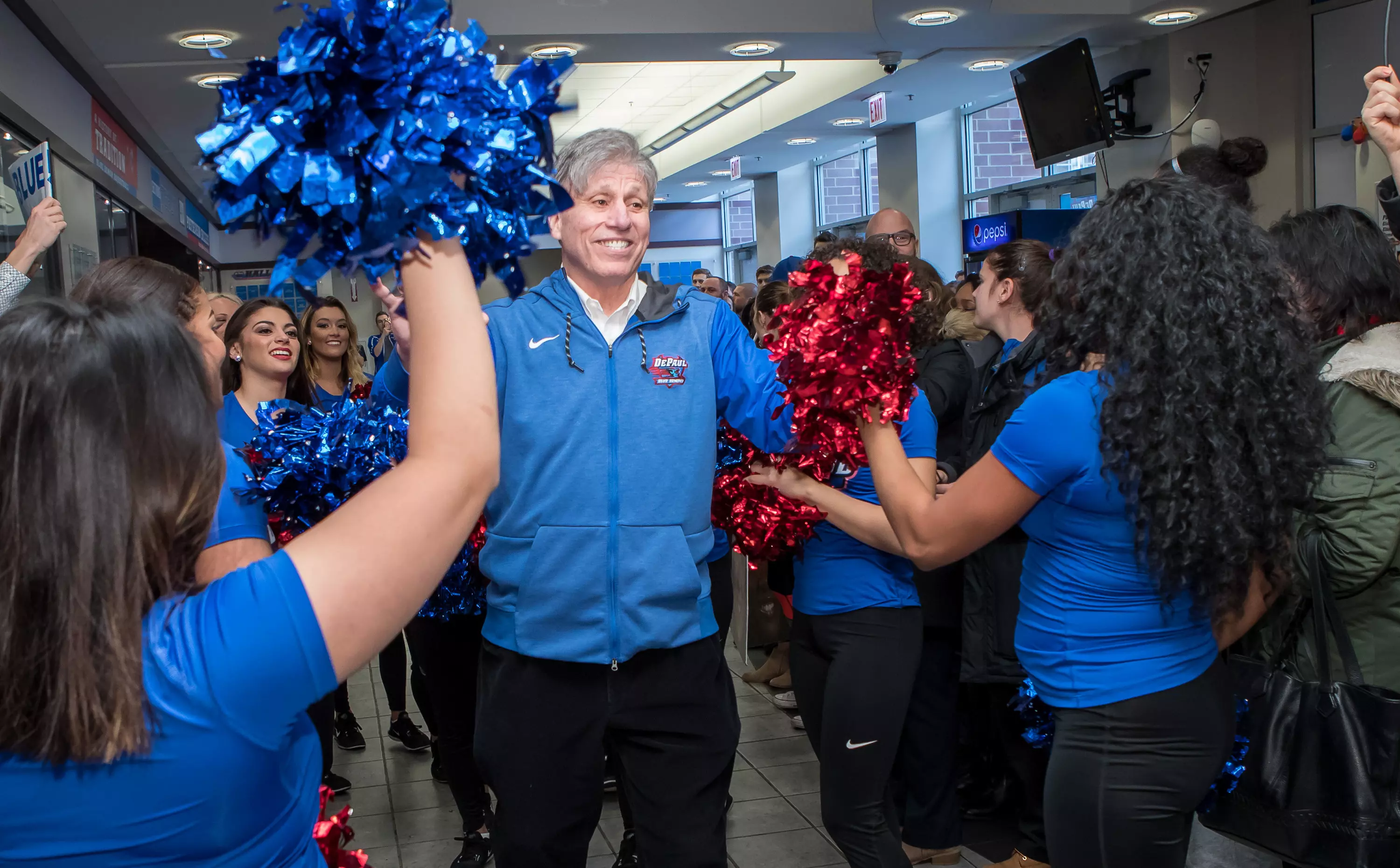 Head coach Doug Bruno walks through the crowd gathered at McGrath-Phillips Arena for the the 2018 NCAA Tournament sendoff.