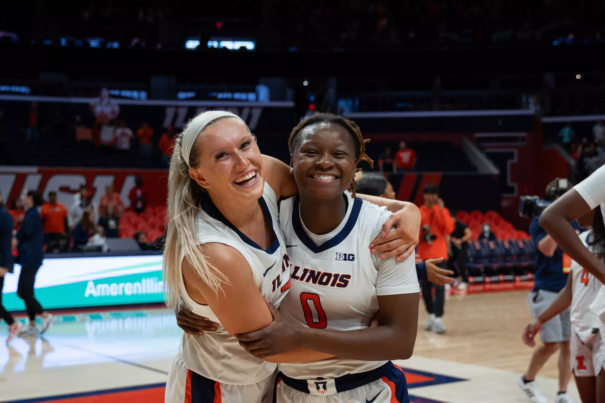 CHAMPAIGN, IL - November 15, 2023 -Illinois Guard Camille Jackson (#0) and Illinois Forward Shay Bollin (#22) after the game between the Saint Peters Peacocks and the Illinois Fighting Illini at State Farm Center in Champaign, IL. Photo By Madison Dabrowski