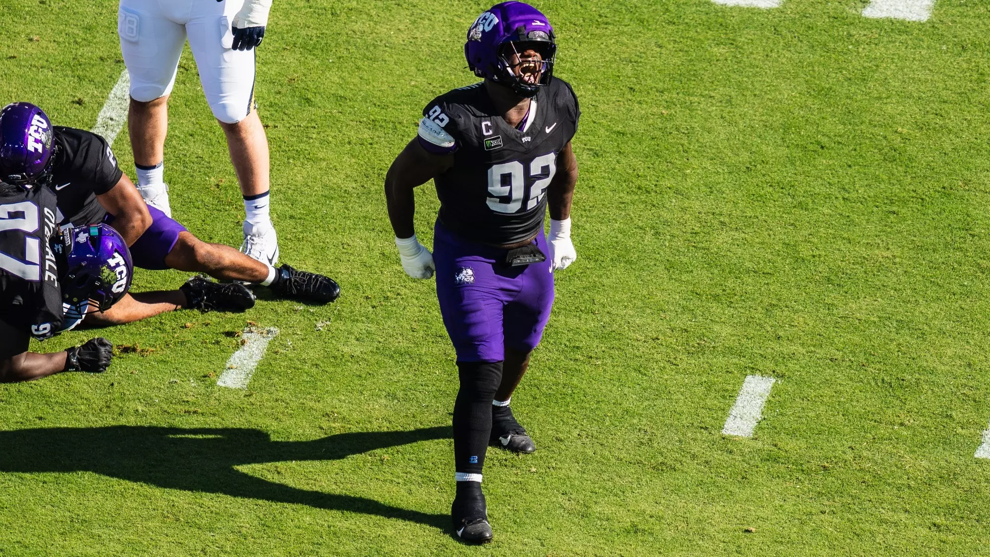 Ansel Din-Mbuh celebrating after a tackle