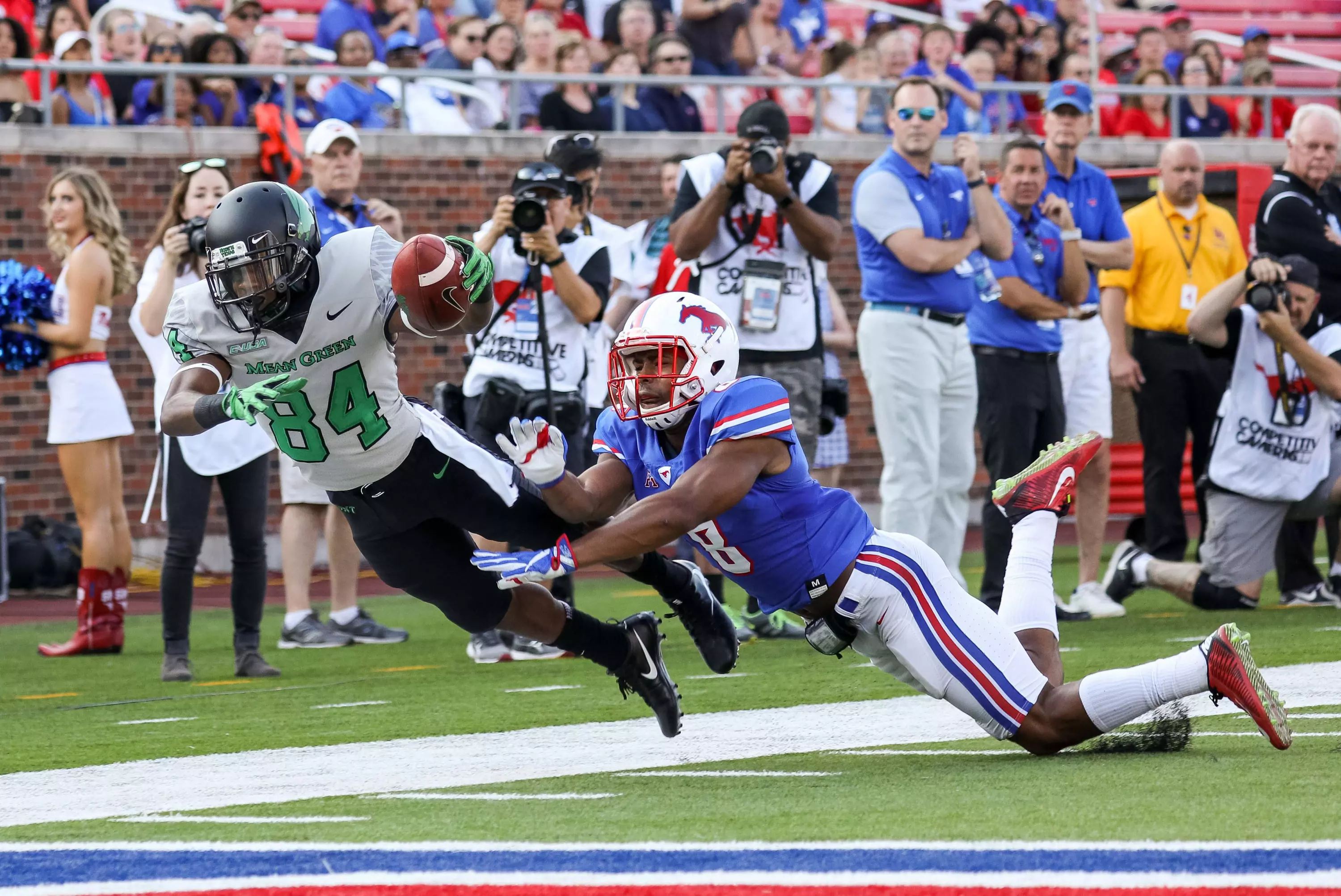North Texas wide receiver Jaelon Darden (84) leaps for the end zone as SMU defensive back Rodney Clemons tries to stop him. Andrew Dieb-USA TODAY Sport