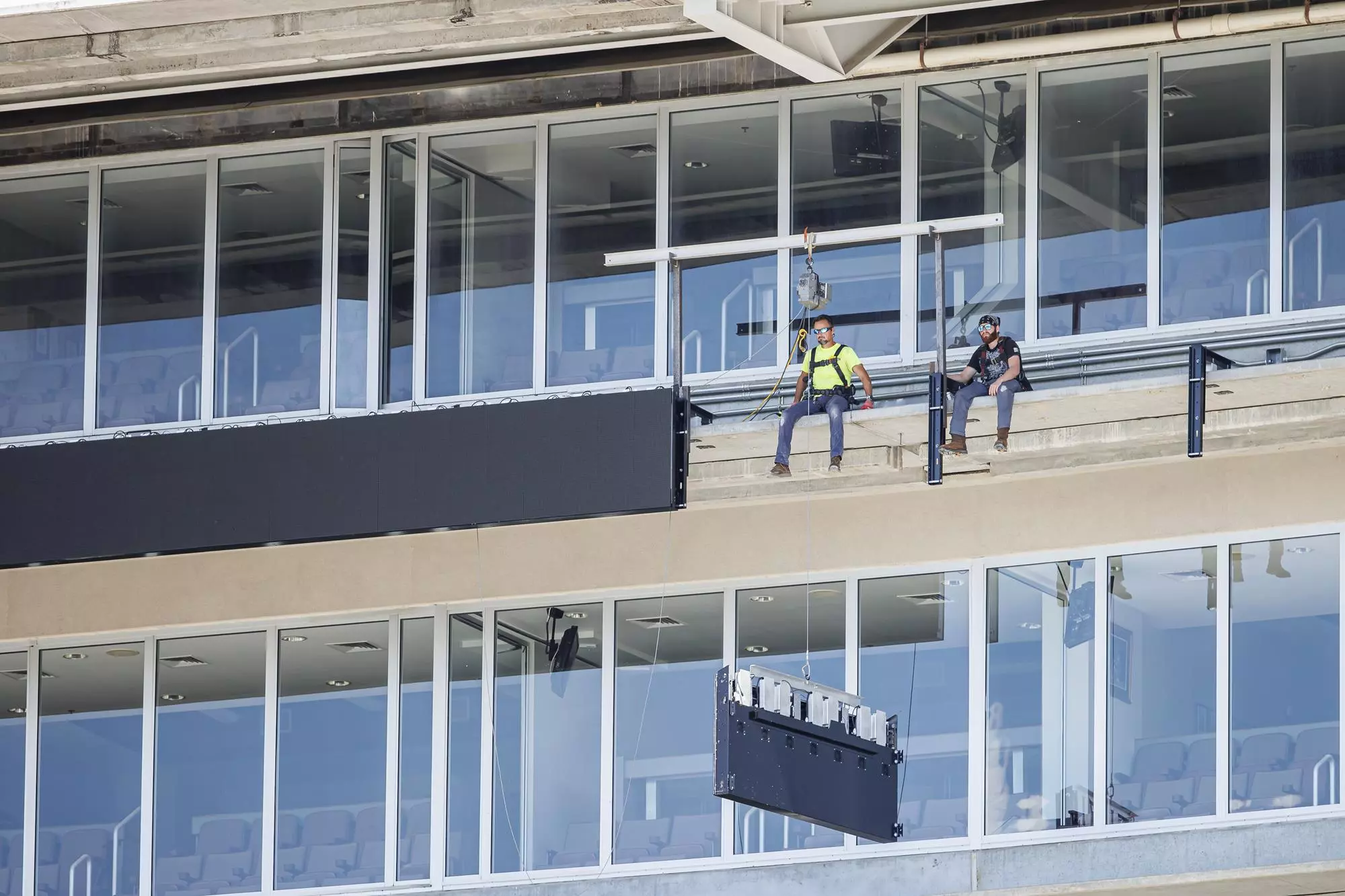 STARKVILLE, MS - August 13, 2022 - Construction crew installs a new LED ribbon board during a fall camp scrimmage at Davis Wade Stadium at Scott Field in Starkville, MS. Photo By Austin Perryman