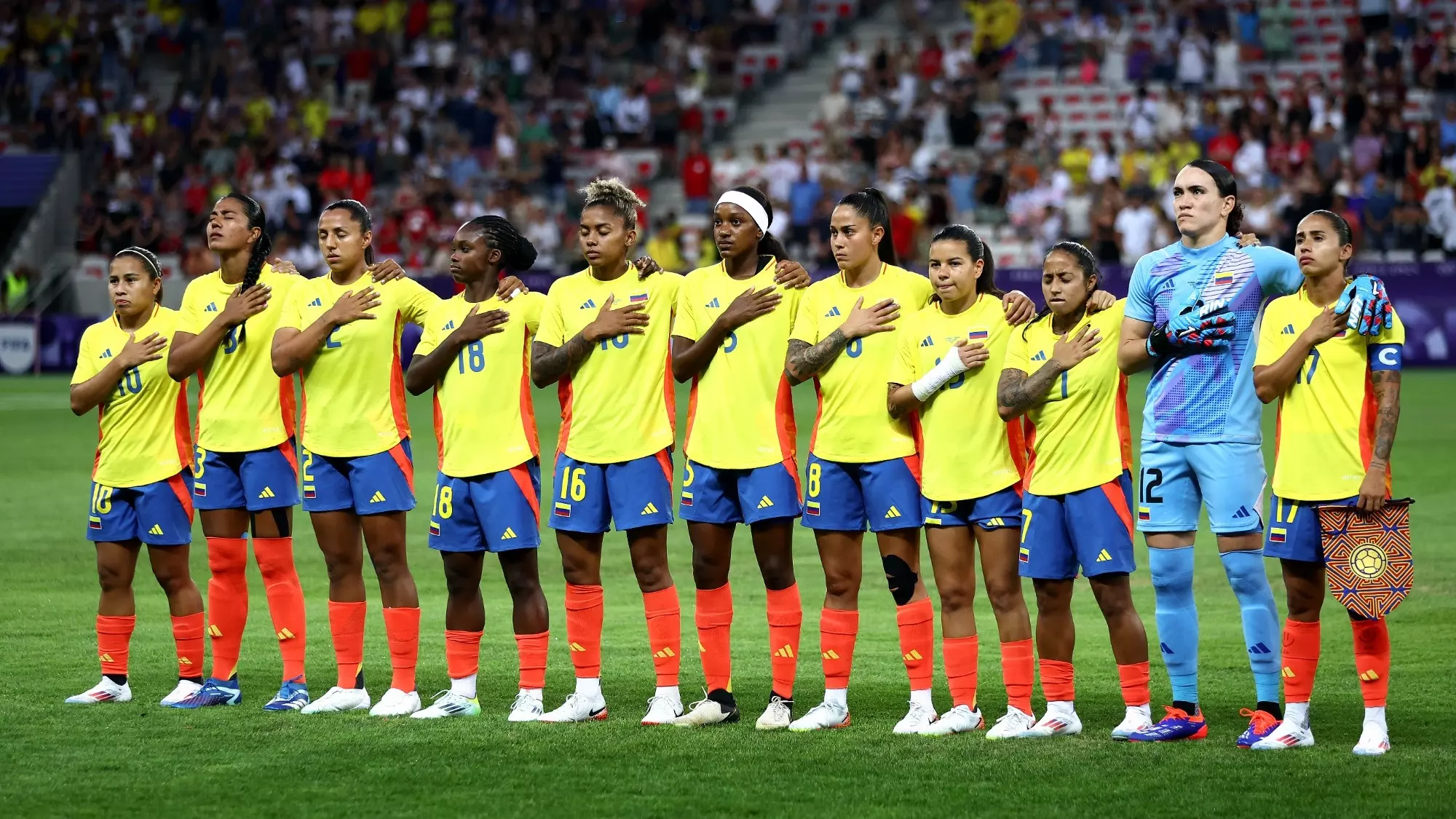 NICE, FRANCE - JULY 31: Players of Team Colombia line up during the National Anthems prior to the Women's group A match between Colombia and Canada during the Olympic Games Paris 2024 at Stade de Nice on July 31, 2024 in Nice, France. (Photo by Marc Atkins/Getty Images)
