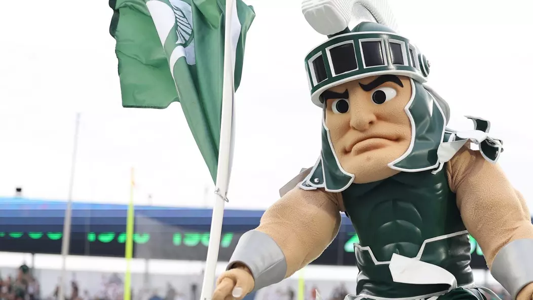 Sparty Planting Flag