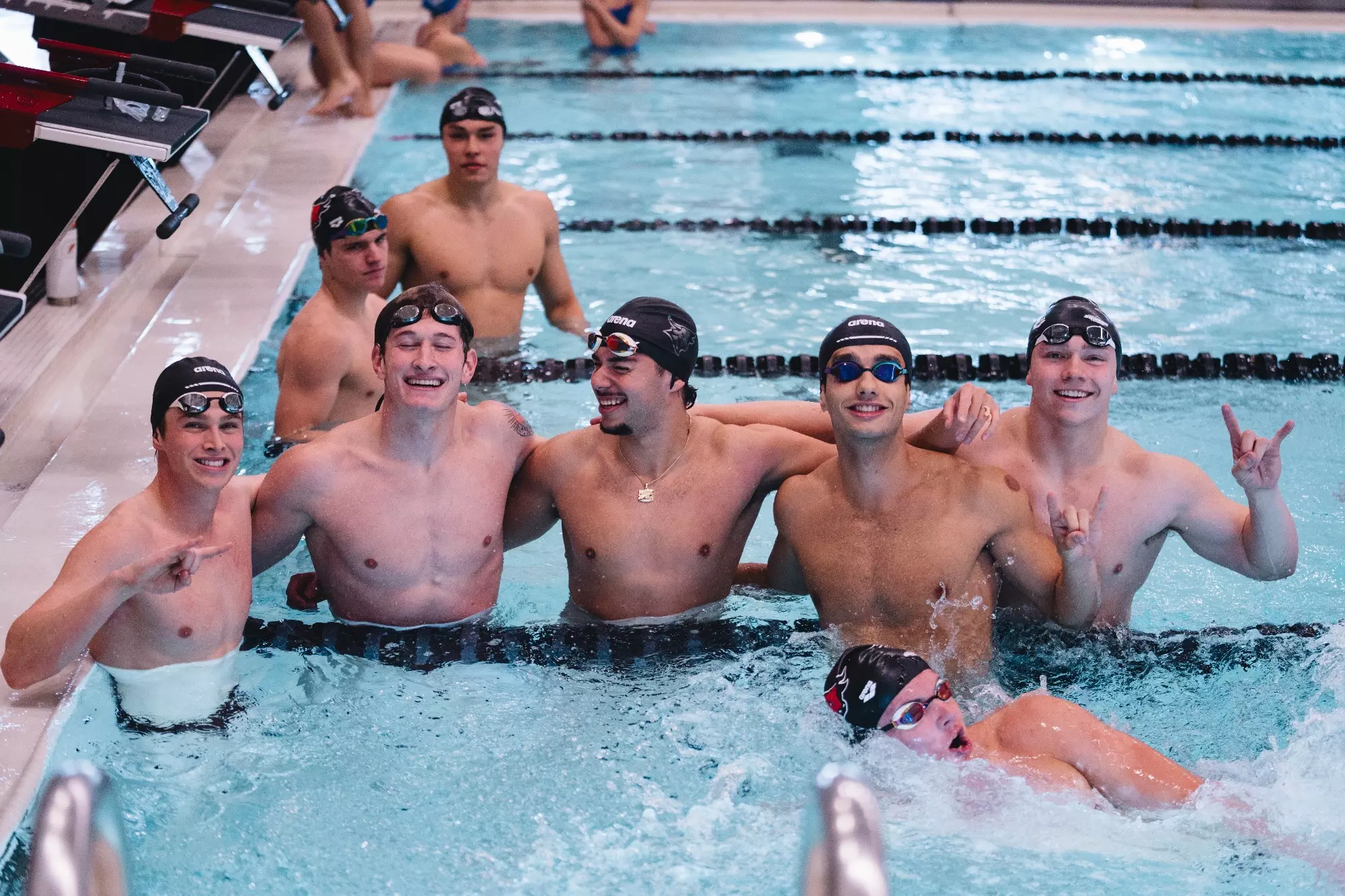 Mens swim celebrates win over SDSU
