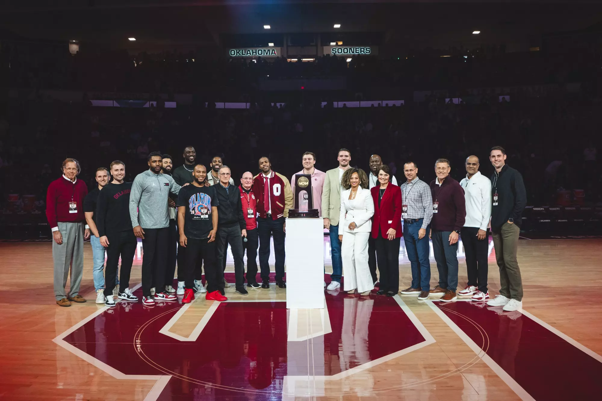 Photo of the 2016 Men's Basketball team and staff during a recognition at Lloyd Noble Center