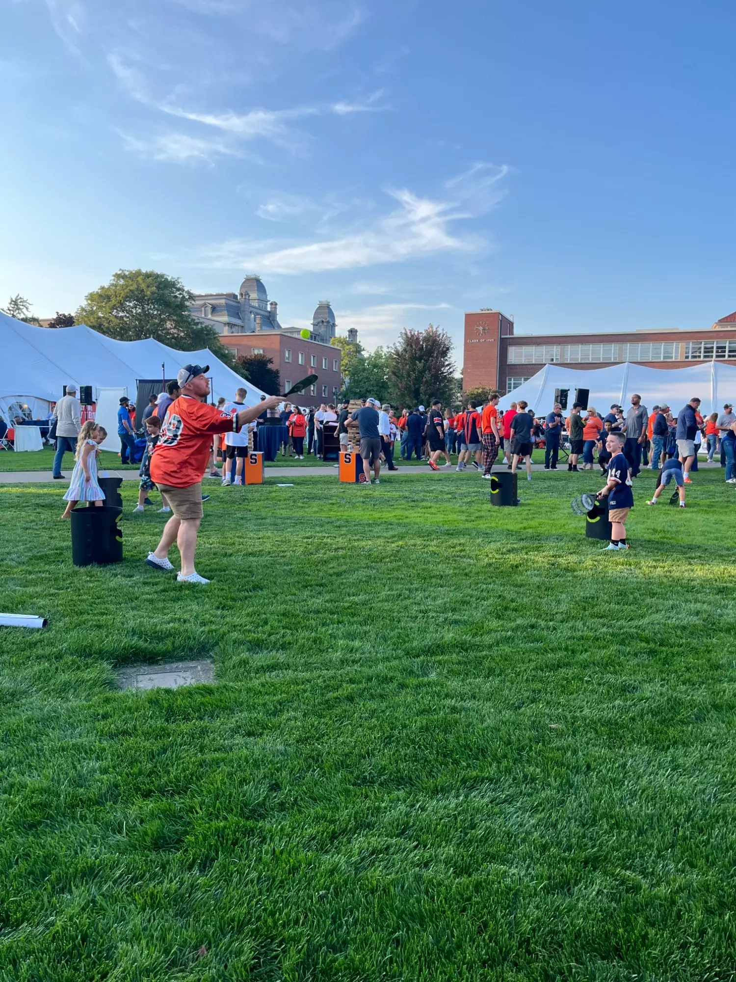Crowd of people playing games at 'Cuse on the Quad