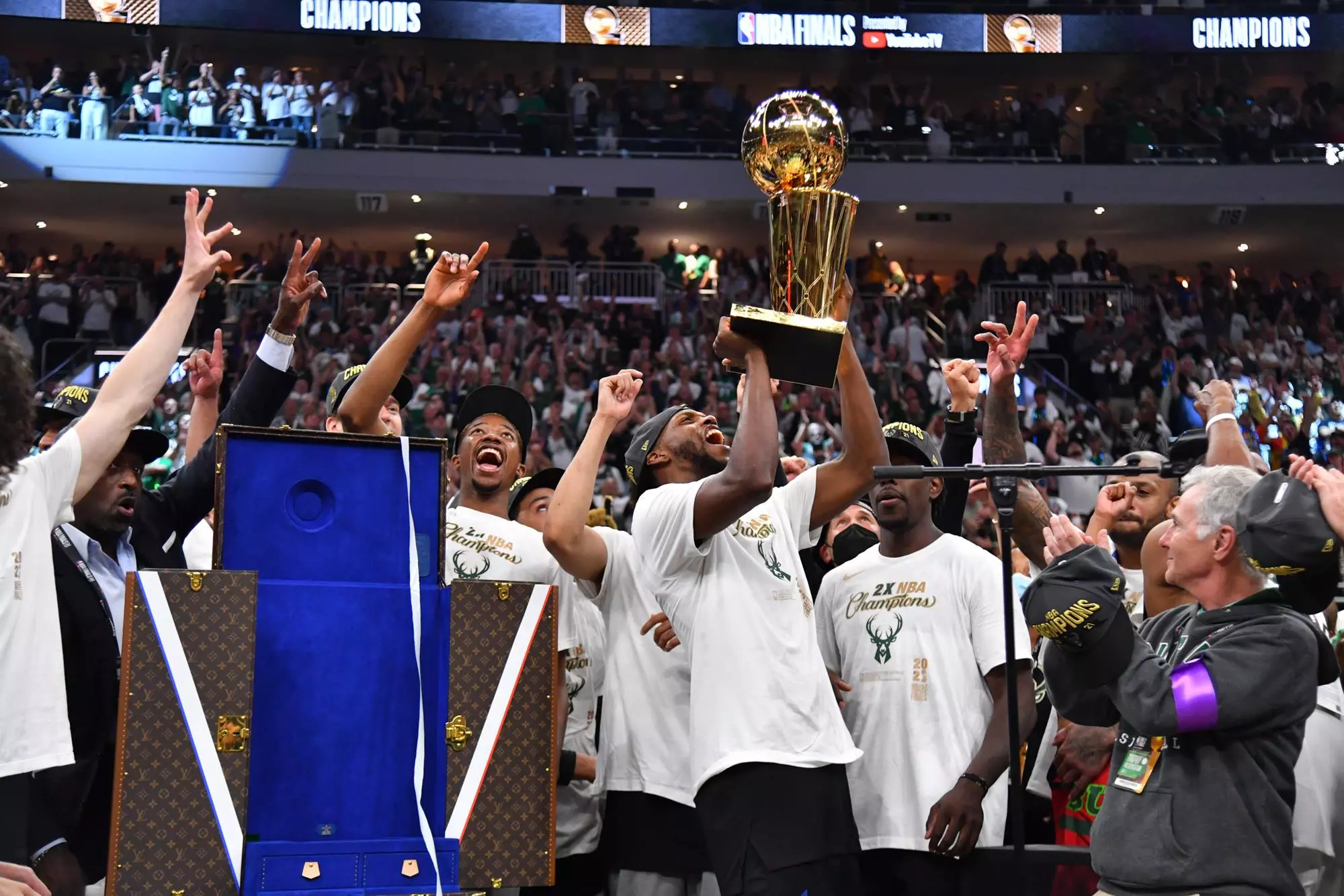 MILWAUKEE, WI - JULY 20: Khris Middleton #22 of the Milwaukee Bucks celebrates with the Larry O'Brien Trophy after winning Game Six of the 2021 NBA Finals against the Phoenix Suns on July 20, 2021 at Fiserv Forum in Milwaukee, Wisconsin. NOTE TO USER: User expressly acknowledges and agrees that, by downloading and/or using this Photograph, user is consenting to the terms and conditions of the Getty Images License Agreement. Mandatory Copyright Notice: Copyright 2021 NBAE (Photo by Jesse D. Garrabrant/NBAE via Getty Images)