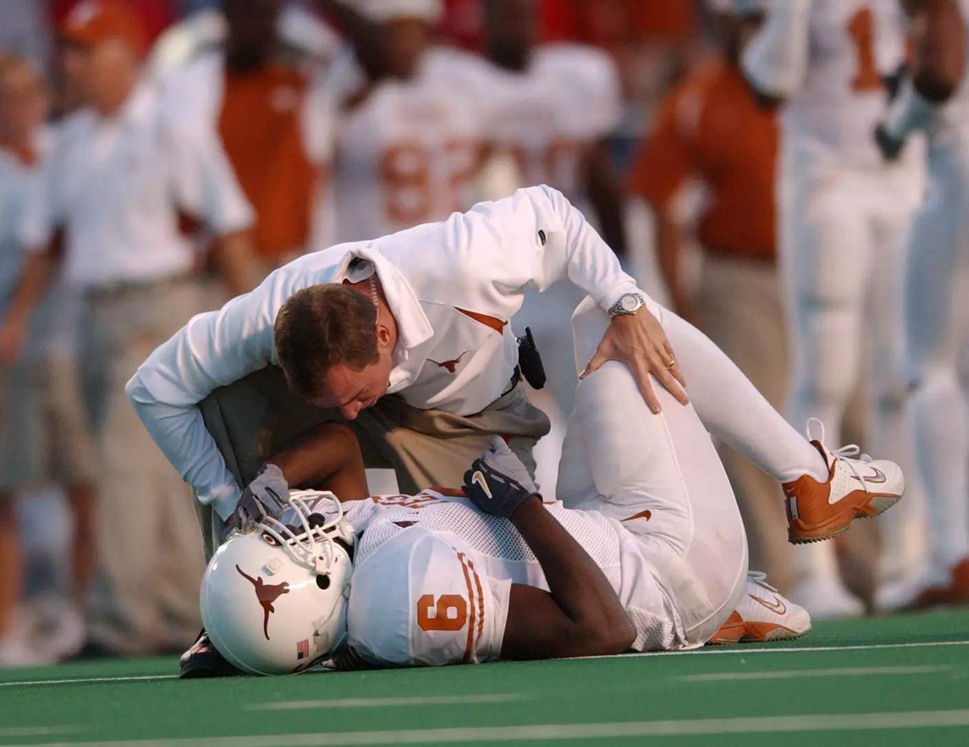 Allen Hardin helps injured football player