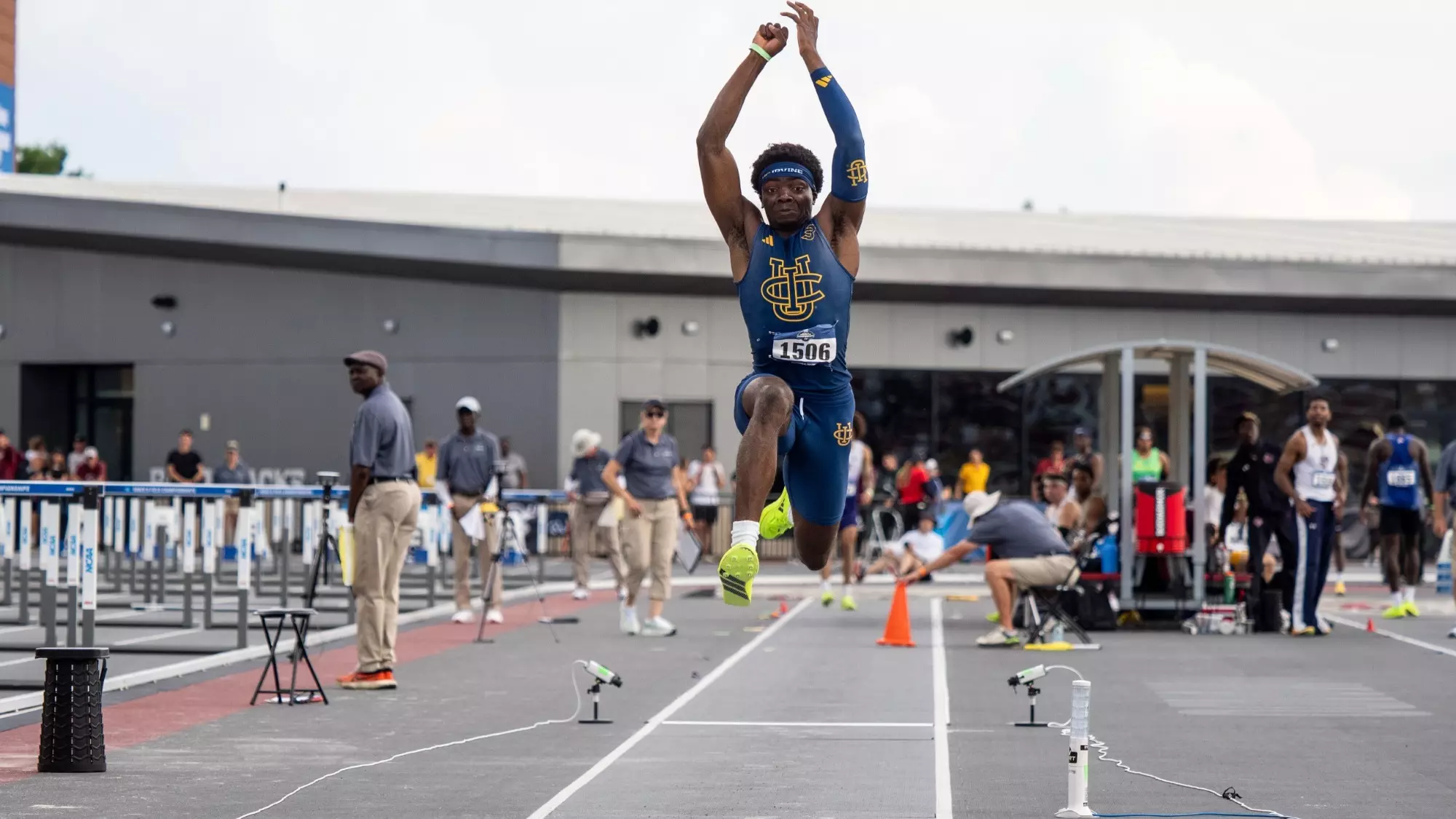 Kenechukwu Okonkwo in mid-air during a triple jump attempt