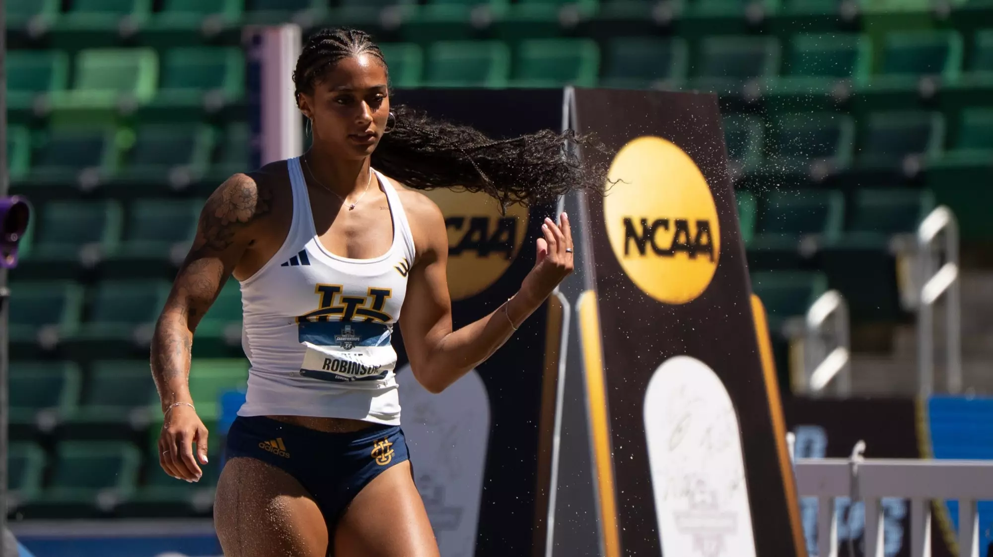 Jolie Robinson in front of an NCAA trophy cutout