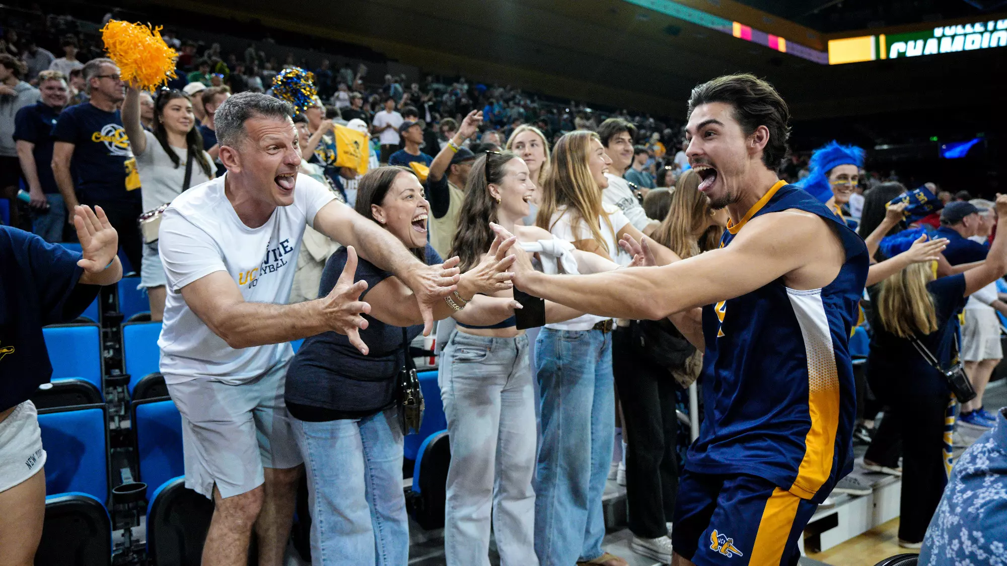 Andon Kiriakou high-fives fans after beating Ball State at NCAA semifinals