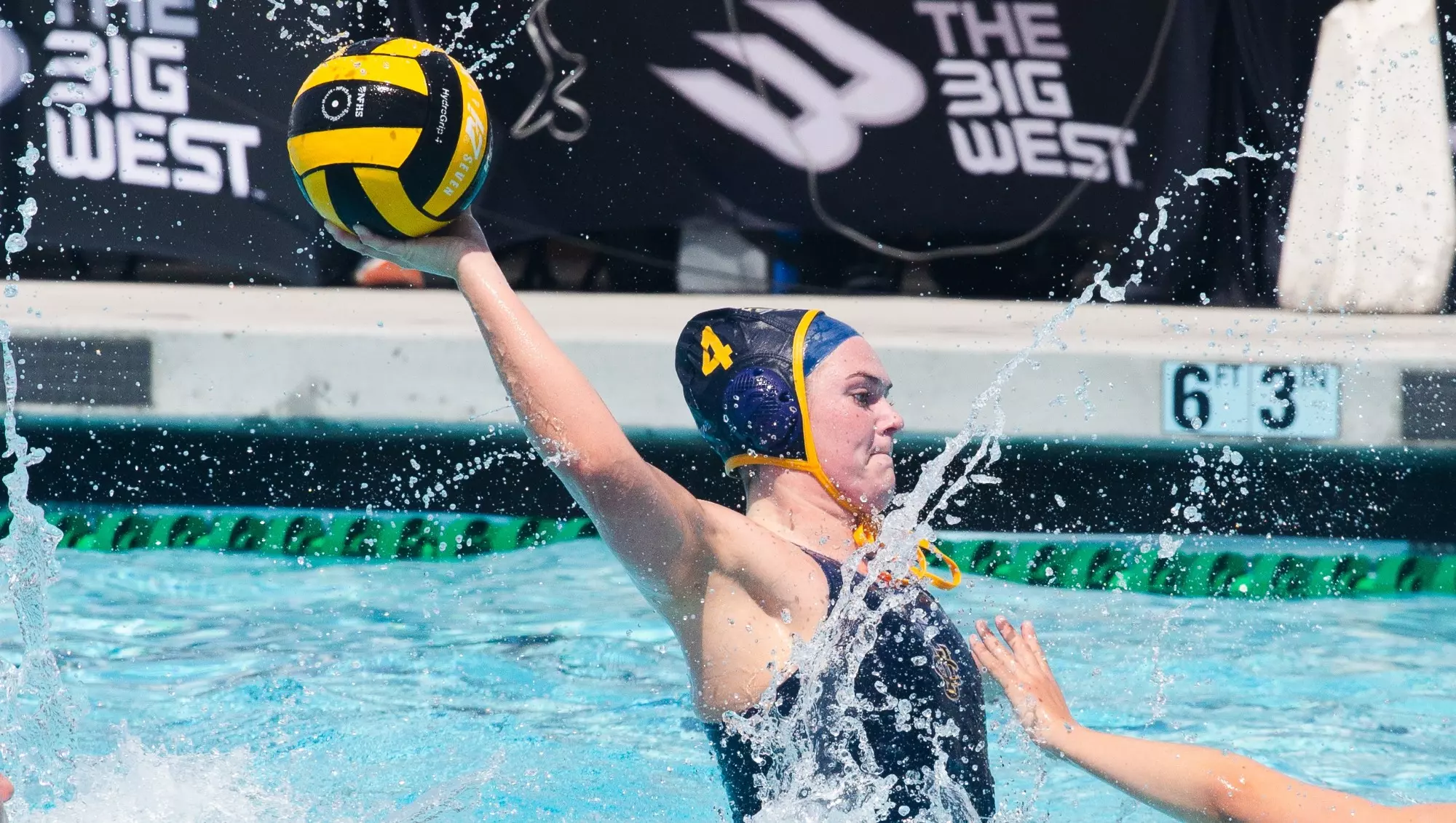 Lauren Hett shoots the ball in a Big West women's water polo match