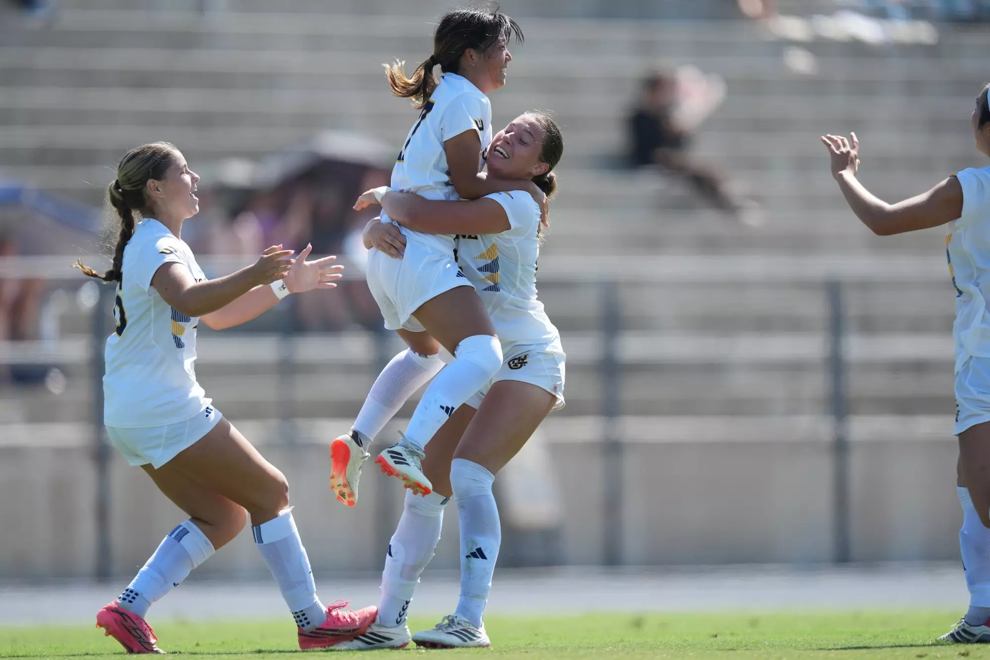 Chifumi Sasaki jumps into the arms of Taylor Esparza to celebrate her equalizing goal in a 2026 match vs. Grand Canyon