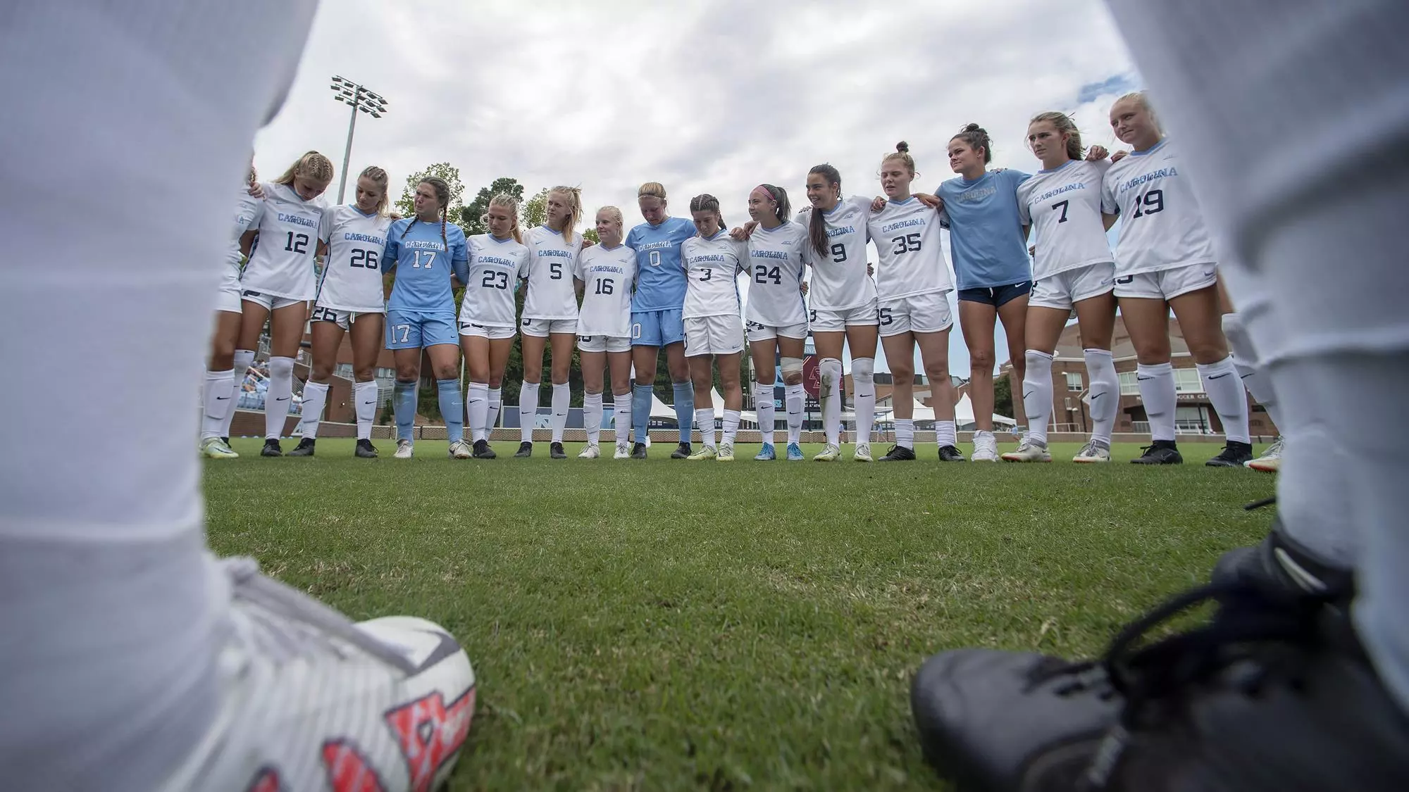 The Tar Heels huddle on the field.