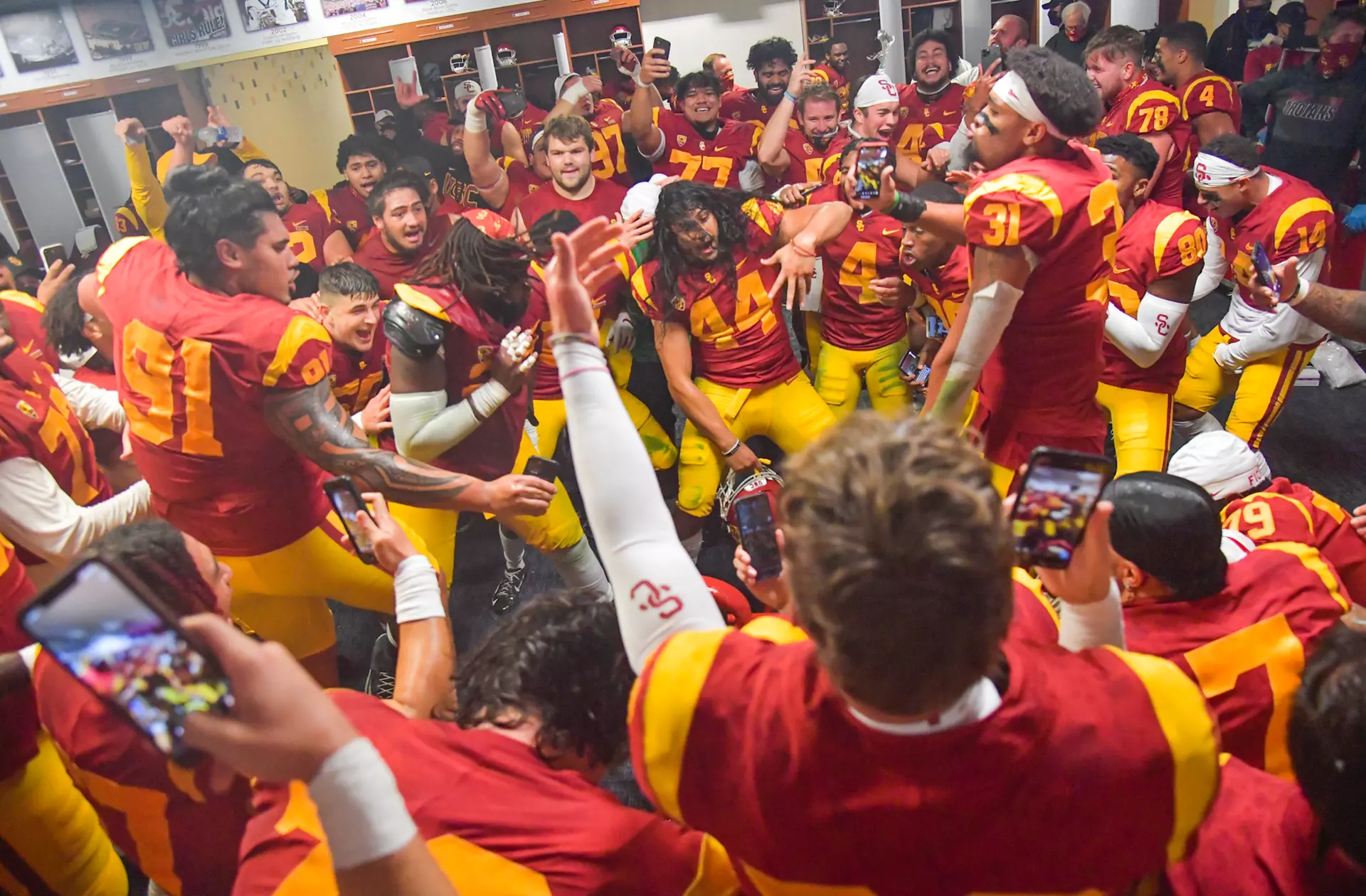 Players celebrate in locker room after beating UCLA