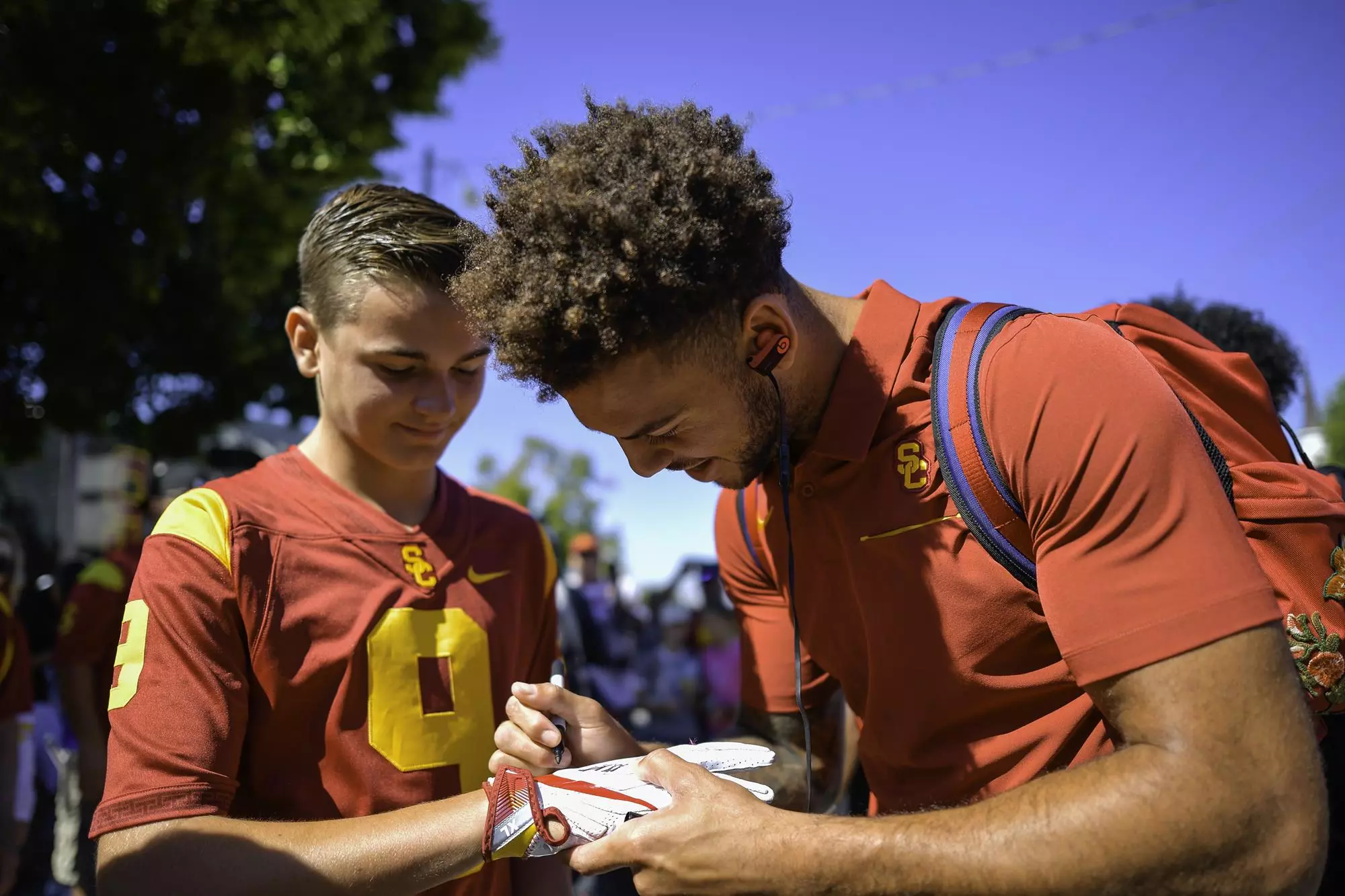 Michael Pittman Jr signs a kid's gloves