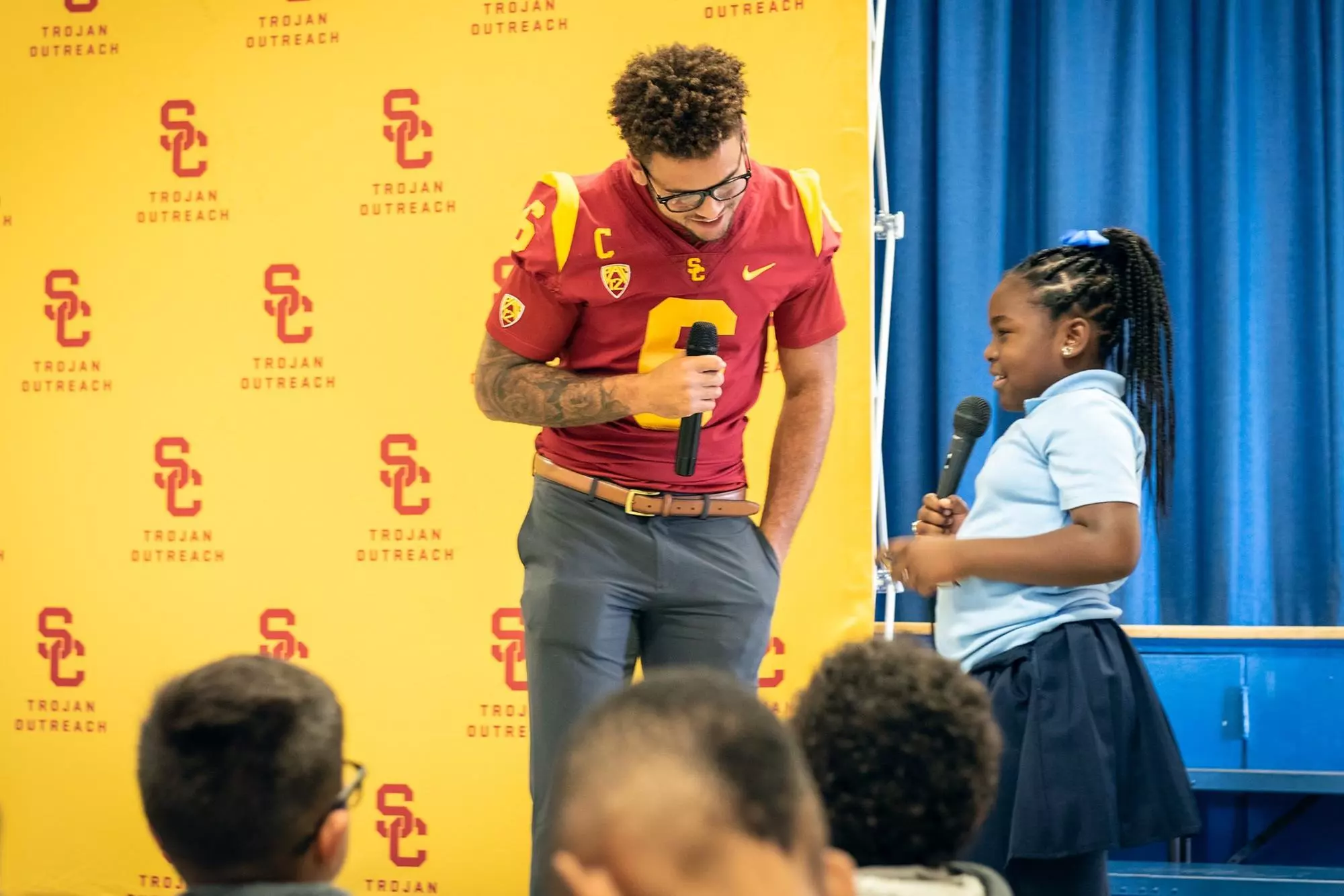 Michael Pittman Jr interacts with young schoolgirl