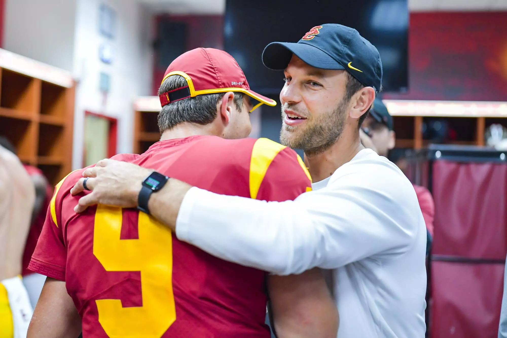 Graham Harrell hugs Kedon Slovis