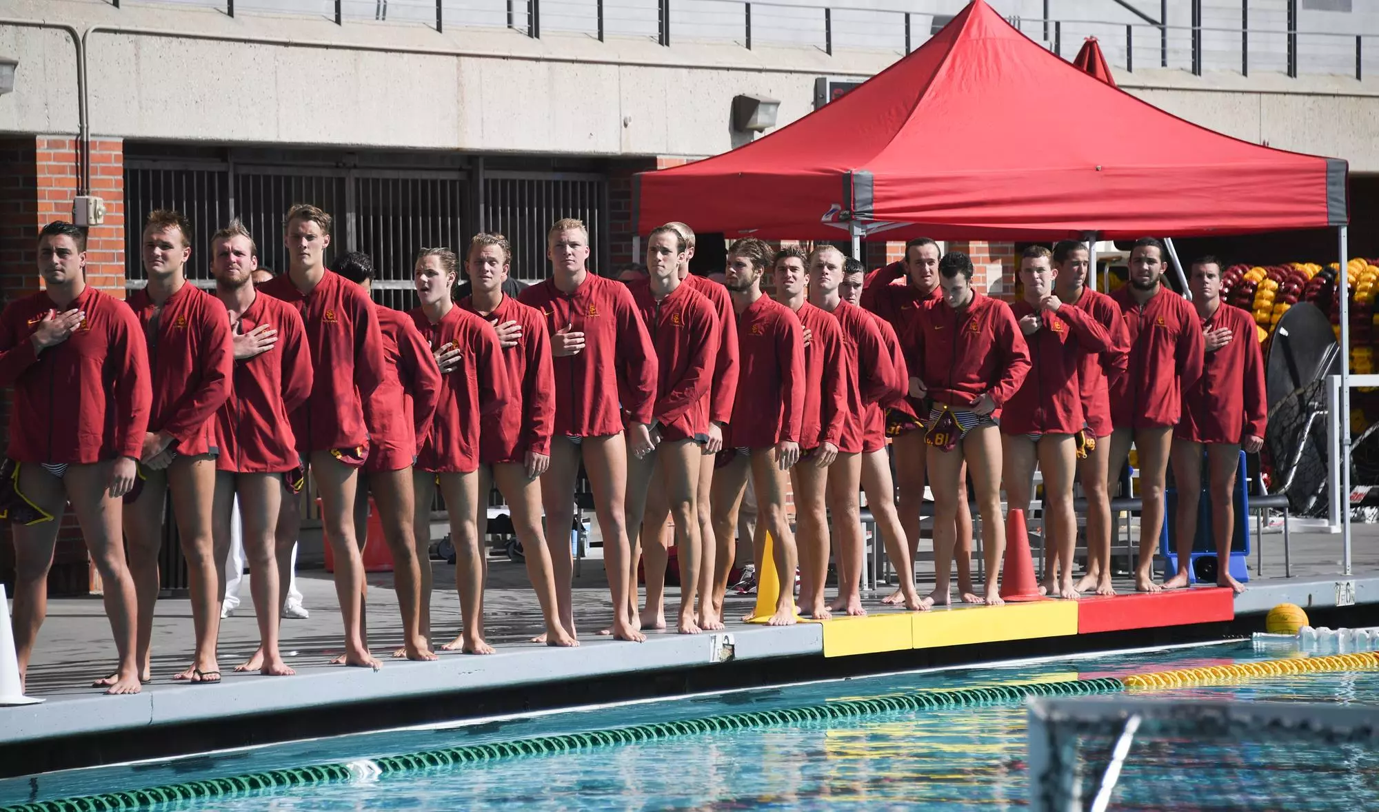 Men's Water Polo players standing for national anthem