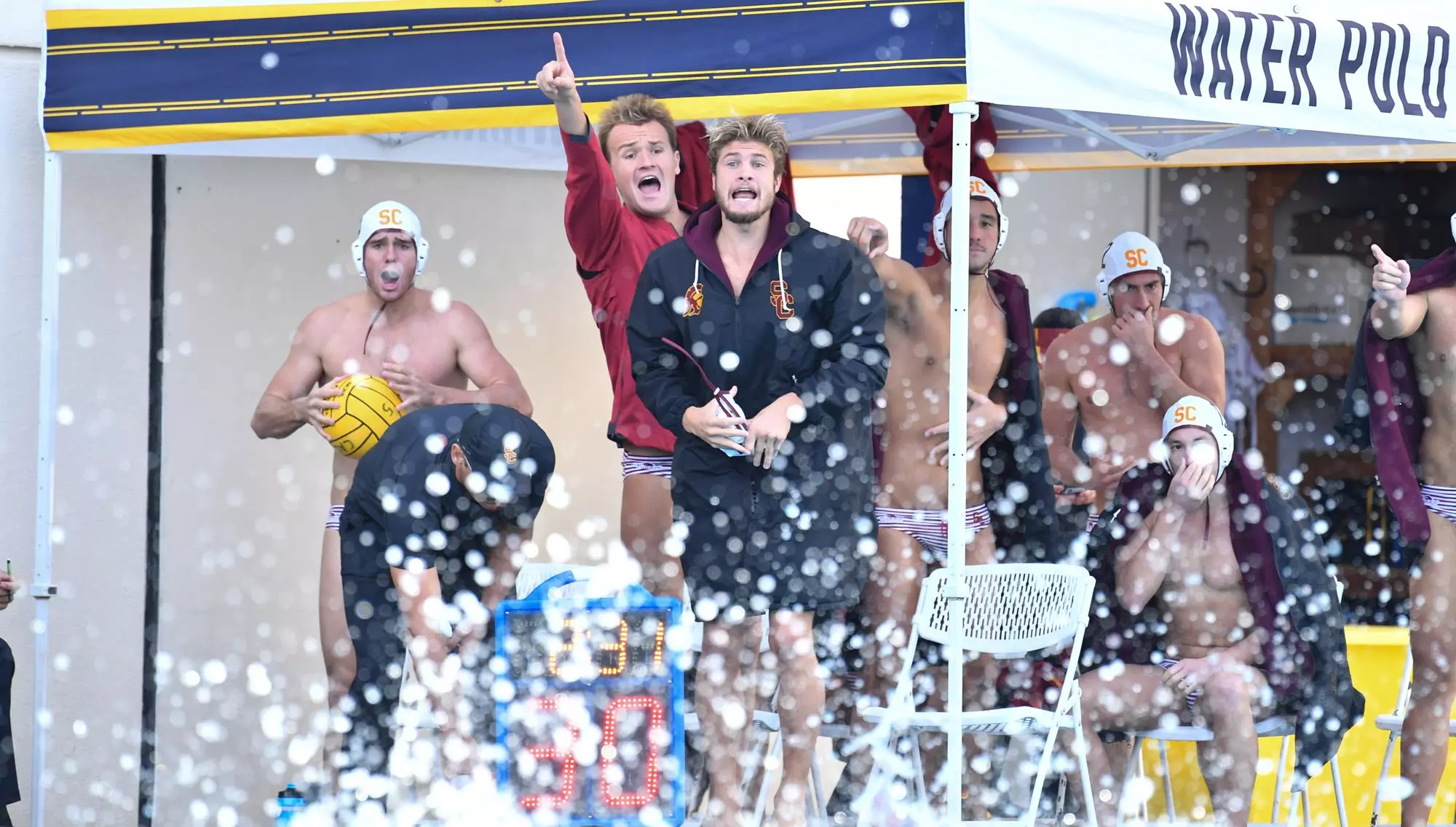 Water Polo playesr cheering on teammates