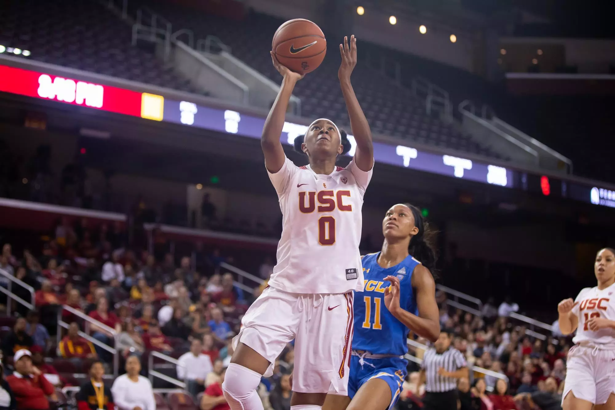 Shalexxus Aaron goes for a layup against UCLA