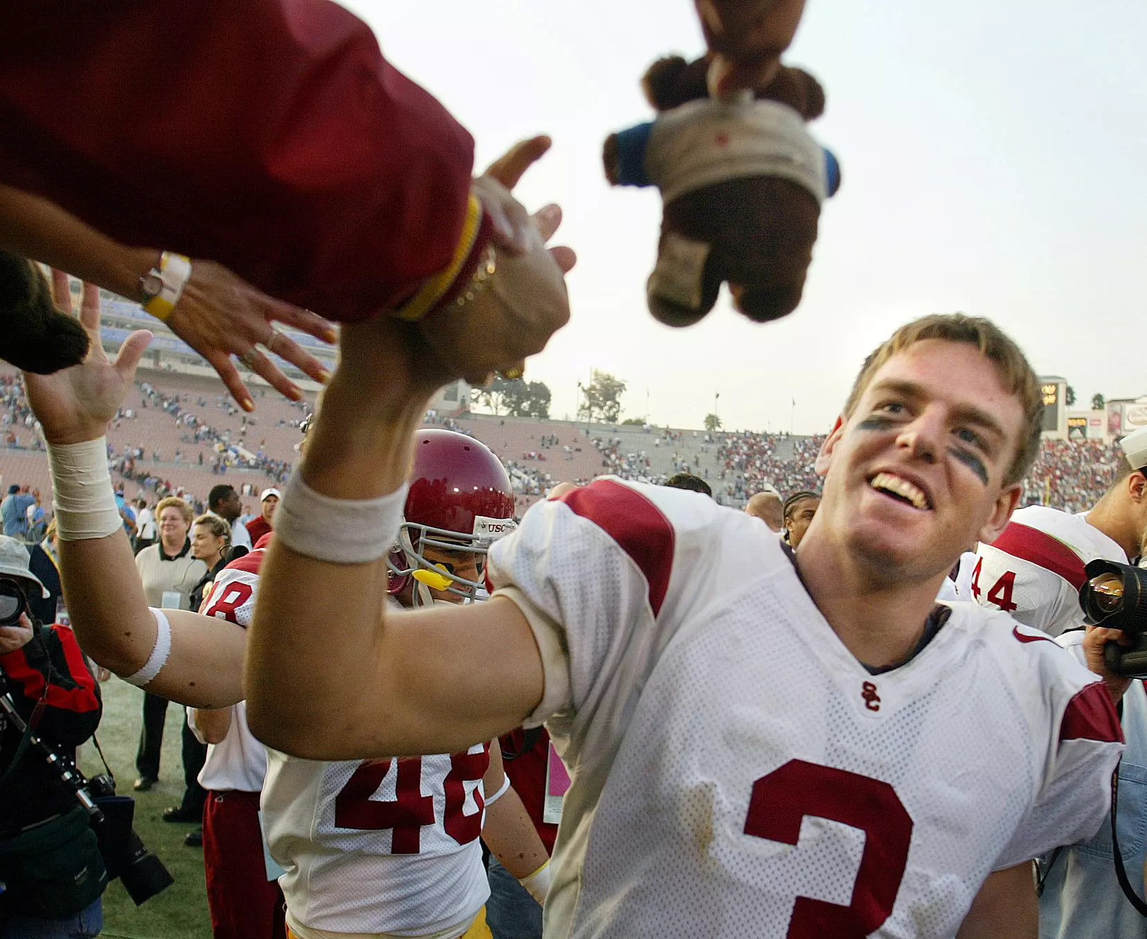 USC's Carson PaUSC's Carson Palmer high-fives fans after USC's 52-21 rout of UCLA Saturday November 23, 2002. (Photo by Kevin Sullivan, Orange County Register/SCNG)