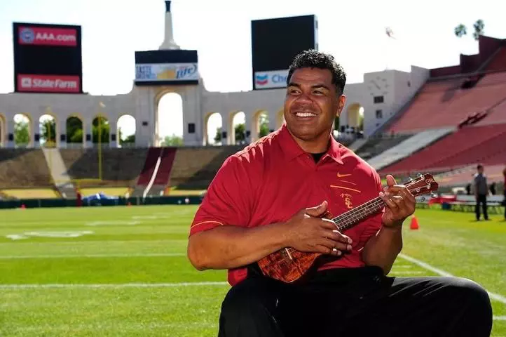 Junior Seau playing ukulele in the Coliseum