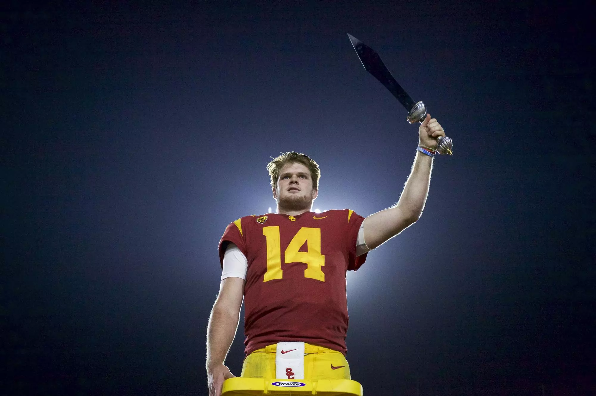 Sam Darnold holds sword after beating UCLA