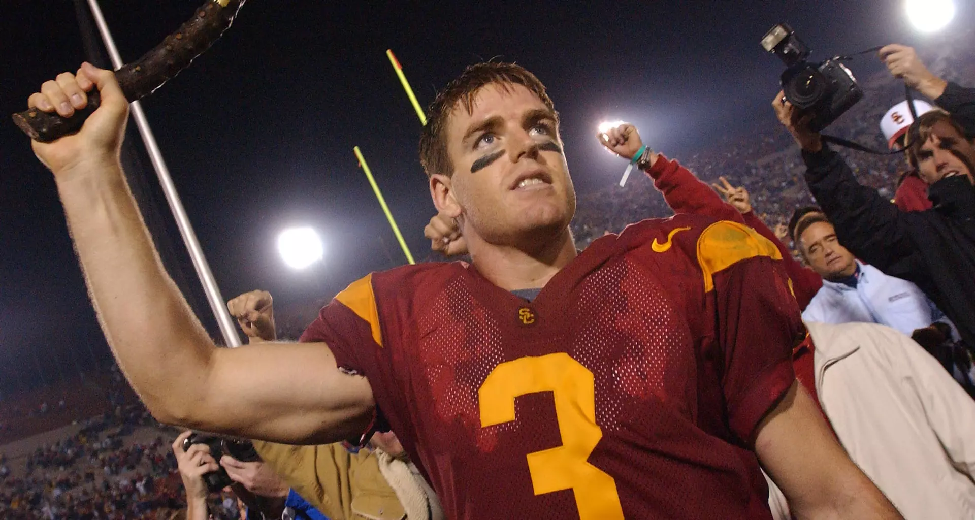Carson Palmer holds Shillelagh after beating Notre Dame