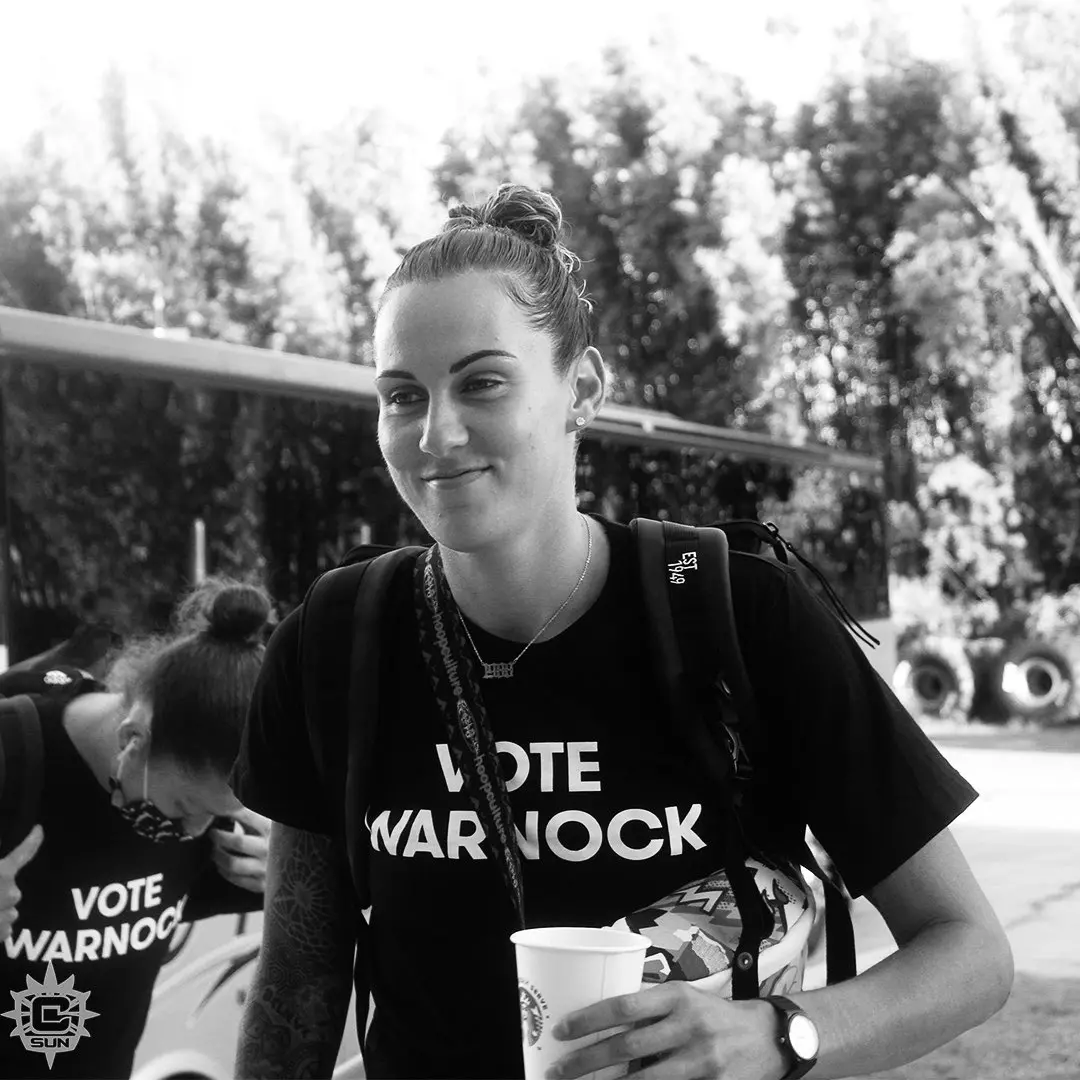 Jacki Gemelos wearing Vote Warnock shirt